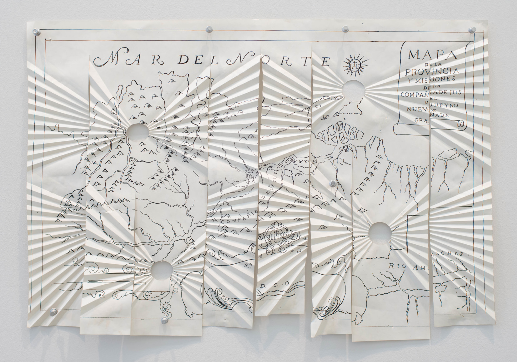 Miguel Angel R&iacute;os, Critica Post-colonial #5, 1993. Photo-print, ink on pleated paper and push pins, 16 1/2 x 24 in. (41.9 x 61 cm.)