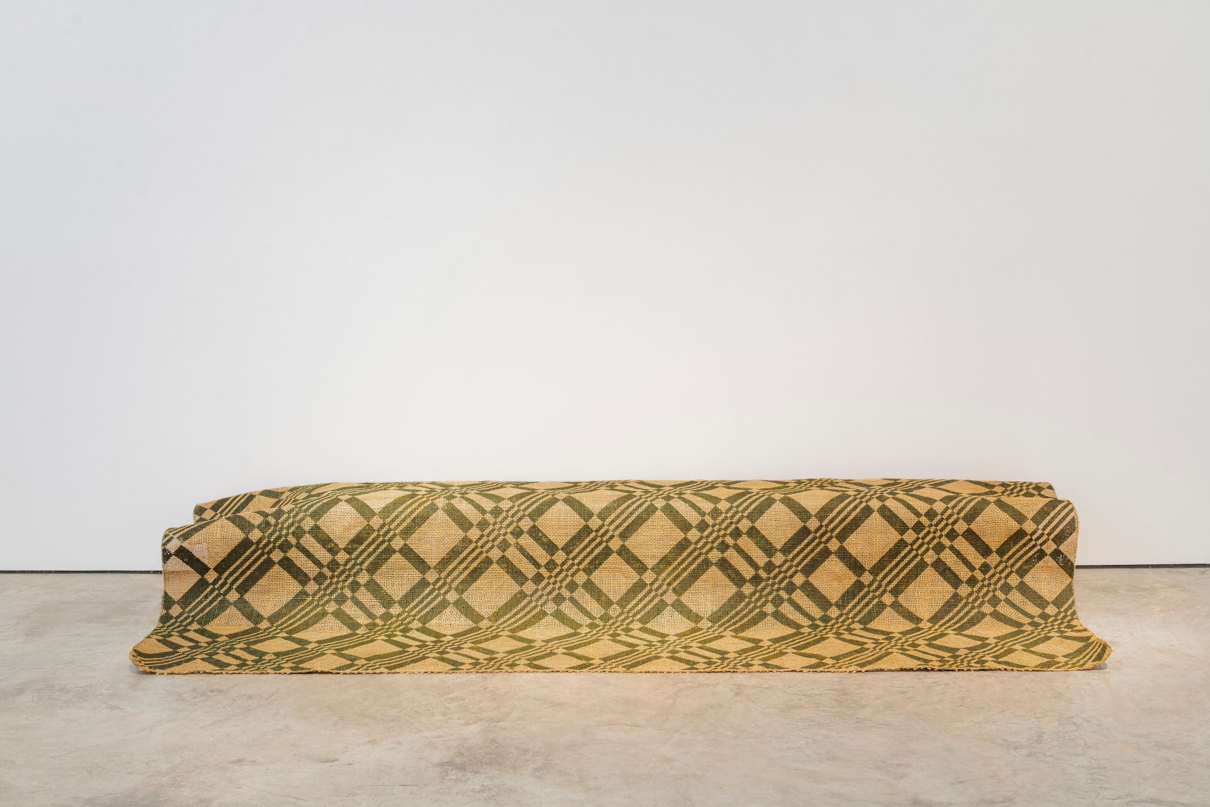 Miguel &Aacute;ngel Rojas, Sin fr&iacute;o permanente, 2012. Impression with coca leaf powder on jute, 96 1/2 x 53 1/8 in. (245.1 x 134.9 cm.)