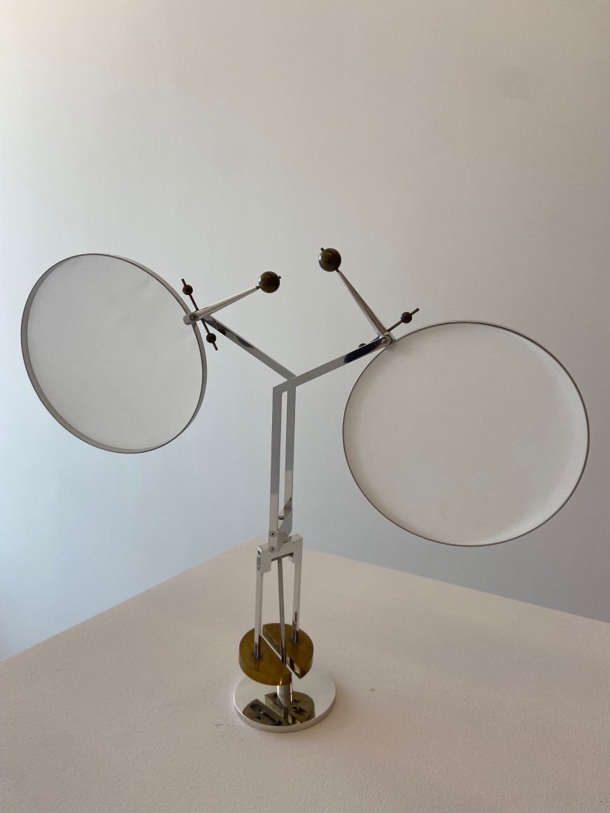 Pedro S. de Movell&aacute;n, Moon, 2002. Mixed metals and fabric material, 23 x 22 in. (58.4 x 55.9 cm.), 4 in. (10.16 cm.) Diameter base.&nbsp;