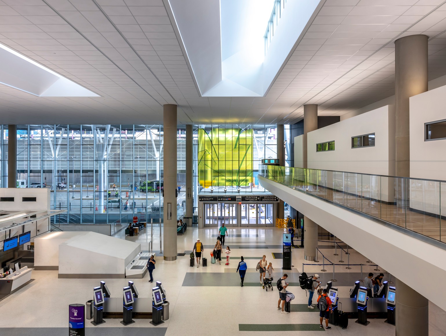 Marta Chilindron, Unexpected Spaces, 2025. Digital print on glass and polished stainless steel, 21&rsquo; x 20&rsquo; (yellow), 21&rsquo; x 35&rsquo; (green), 15&rsquo; x 27&rsquo; 6&rdquo; (blue). Permanent installation at George Bush Intercontinental Airport (IAH), Terminal E. Image courtesy of Houston Airports. Photos by Slyworks.