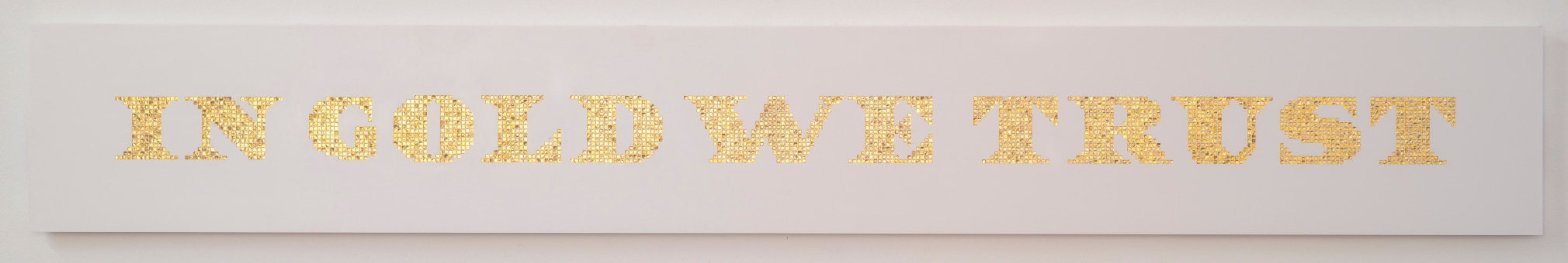 Miguel &Aacute;ngel Rojas, Tables of the Law series: In Gold We Trust, 2018. Copper, gold plated on Corian, 11 x 80 5/16 x 1 1/16 in. (27.9 x 204 x 2.7 cm.)