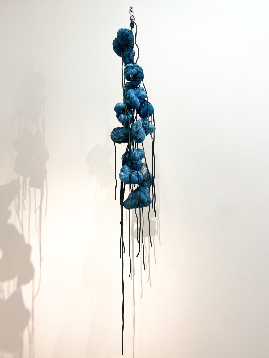 Sandra Monterroso,&nbsp;Puntos en resistencia azul,&nbsp;Edition. 7/13, 2019. Installation Indigo dyed yarn, loop, steel rope, 13 knots, 53 x 8 x 8 in. (134.6 x 20.3 x 20.3 cm.)