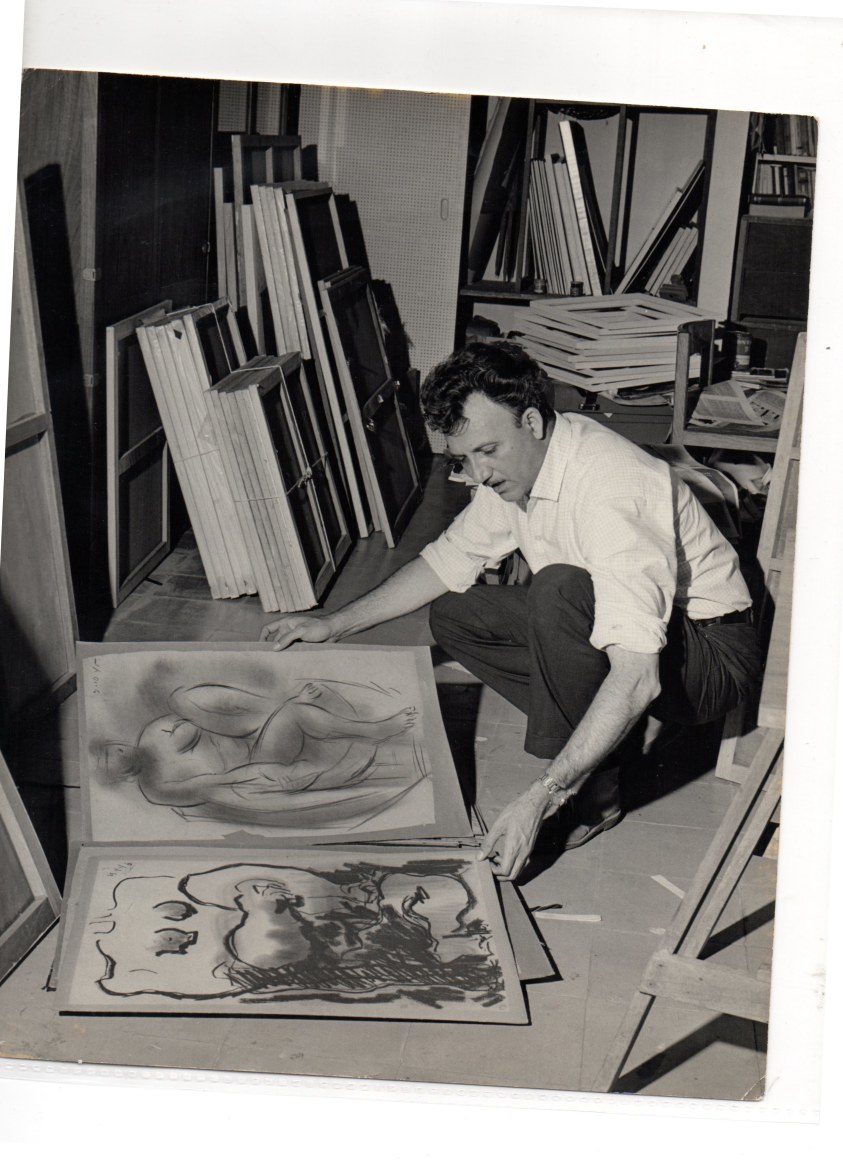 Alejandro Otero over some of his drawings at his studio in San Antonio de los Altos, Venezuela, 1960. Photo courtesy of the Otero Pardo Foundation Archives.