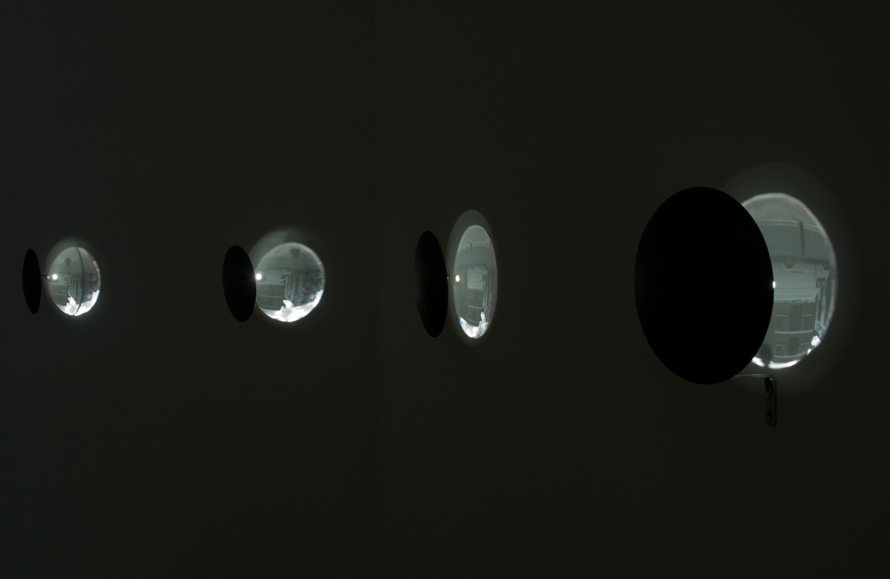 Oscar Mu&ntilde;oz,&nbsp;Eclipse [Ed. of 3 + 2AP], 2000-2002. Concave mirrors. Solo exhibition&nbsp;Oscar Mu&ntilde;oz: Mirror Image&nbsp;at Iniva, London, 2008. Photo courtesy Thierry Bal.