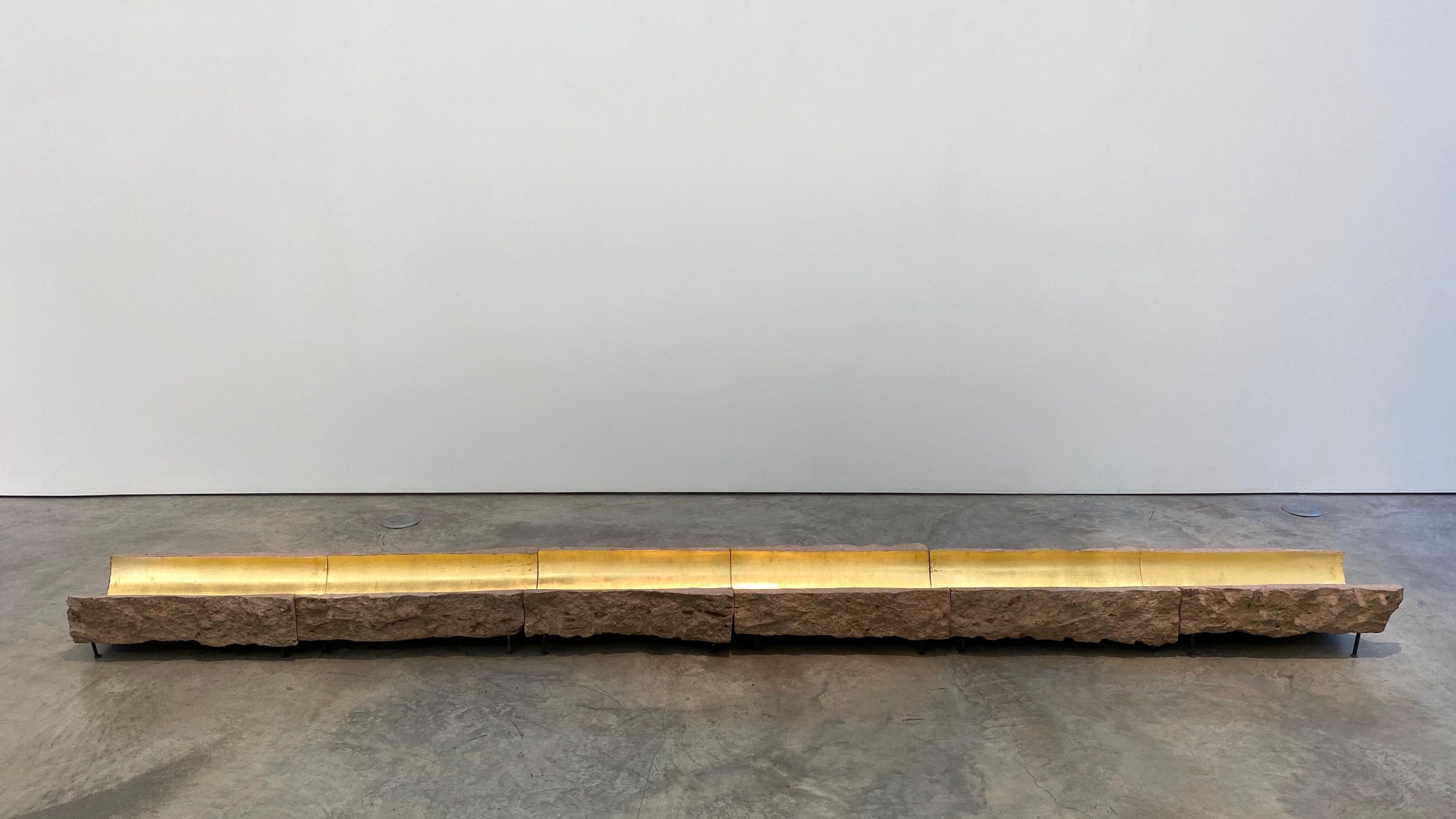 Thomas Glassford, Locus Classicus, 2018. Stone and gold leaf, 8 1/2 x 149 x 14 1/2 in. (21.6 x 378.5 x 36.8 cm.)