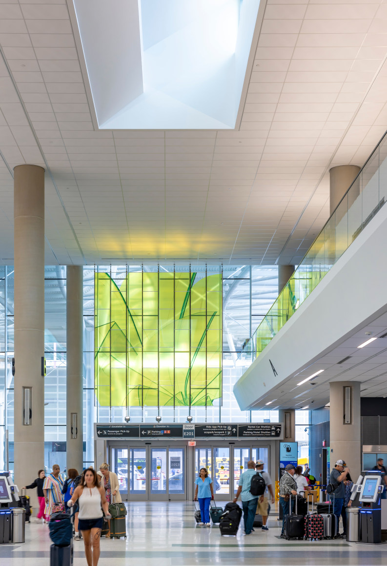 Marta Chilindron, Unexpected Spaces, 2025. Digital print on glass and polished stainless steel, 21&rsquo; x 20&rsquo; (yellow), 21&rsquo; x 35&rsquo; (green), 15&rsquo; x 27&rsquo; 6&rdquo; (blue). Permanent installation at George Bush Intercontinental Airport (IAH), Terminal E. Image courtesy of Houston Airports. Photos by Slyworks.