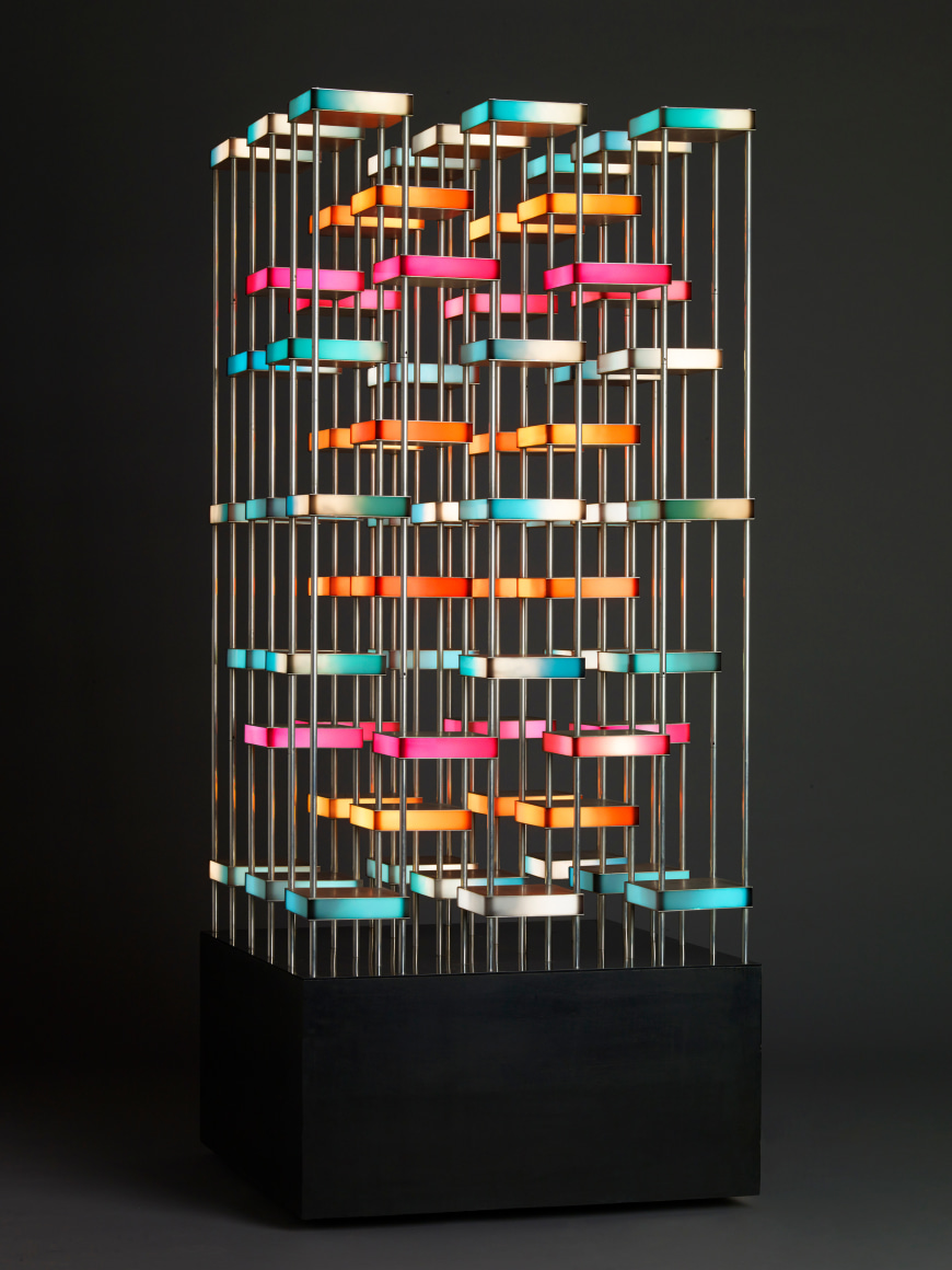 Gregorio Vardanega, Tour Orthogonale, 1987. Aluminum, Plexiglas, wood, light bulbs, motor, 74 1/2 x 32 1/4 x 32 1/4 in. (189.2 x 81.9 x 81.9 cm.)