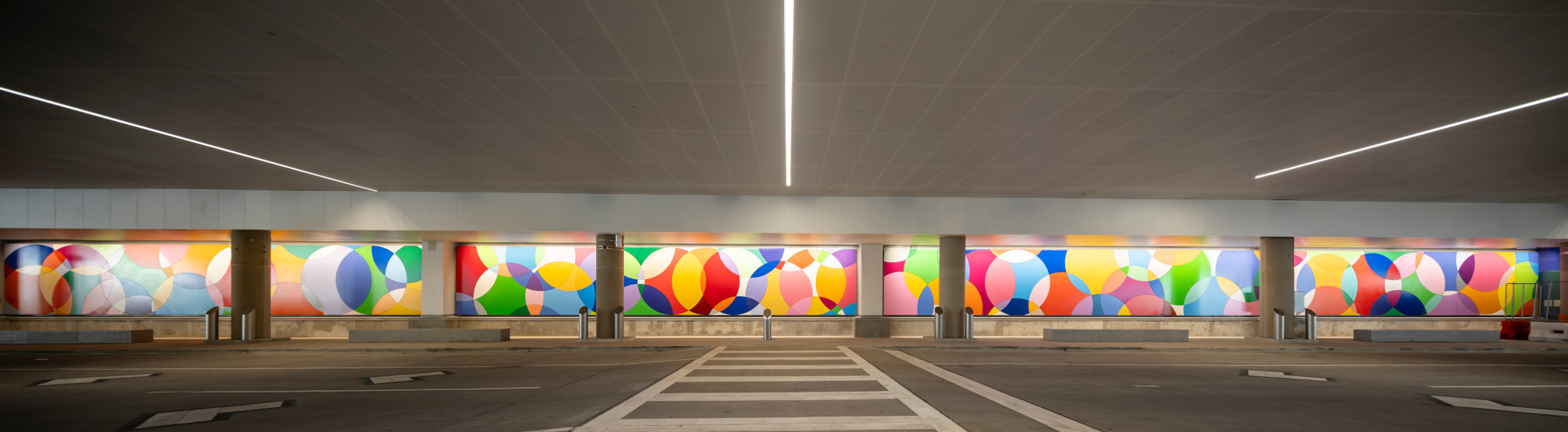 Graciela Hasper, Continuous Motion, 2025. Carbon steel and industrial paint, 9&#039;7&quot; x 208&#039;6&quot;. Permanent installation at George Bush Intercontinental Airport (IAH), Terminal E. Image courtesy of Houston Airports. Photos by Slyworks.
