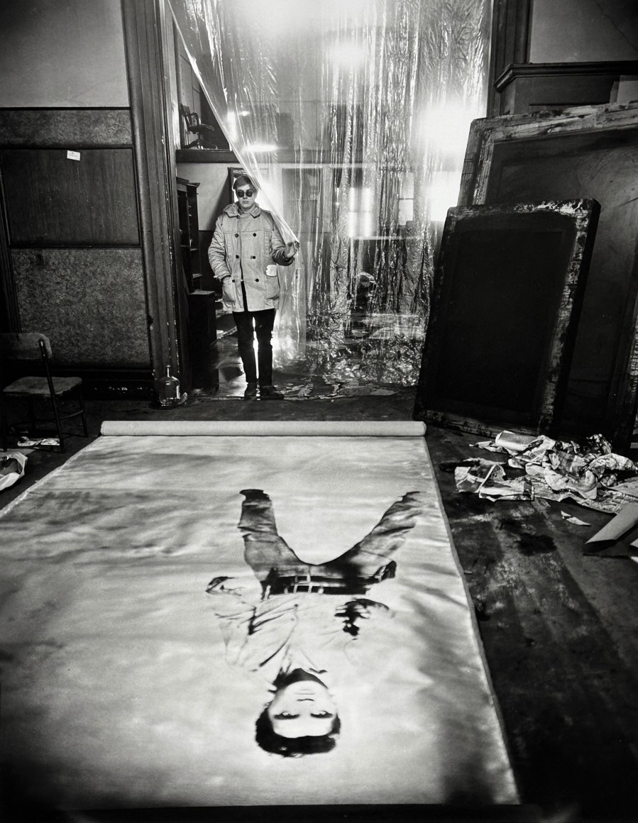 Andy Warhol (in his Studio with Elvis Presley Print), New York, 1962
