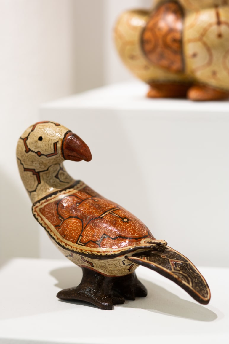 OAF Curated Space:&nbsp;The Hummingbird Paints Fragrant Songs: Sara Flores and Celia Vasquez Yui,&nbsp;Outsider Art Fair New York 2020 (installation view). Artwork: Celia Vasquez Yui,&nbsp;Loro, 2019, Coil-built pre-fire slip-painted clay and vegetal resins, 6.5 x 3.3 x 6.7 inches&nbsp; &nbsp; &nbsp; &nbsp; &nbsp; &nbsp; &nbsp; &nbsp; &nbsp; &nbsp; &nbsp; &nbsp; &nbsp;., Photo by Olya Vysotskaya