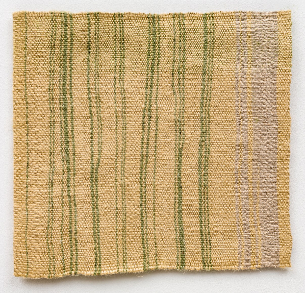 Helen Mirra Green tying bale edging