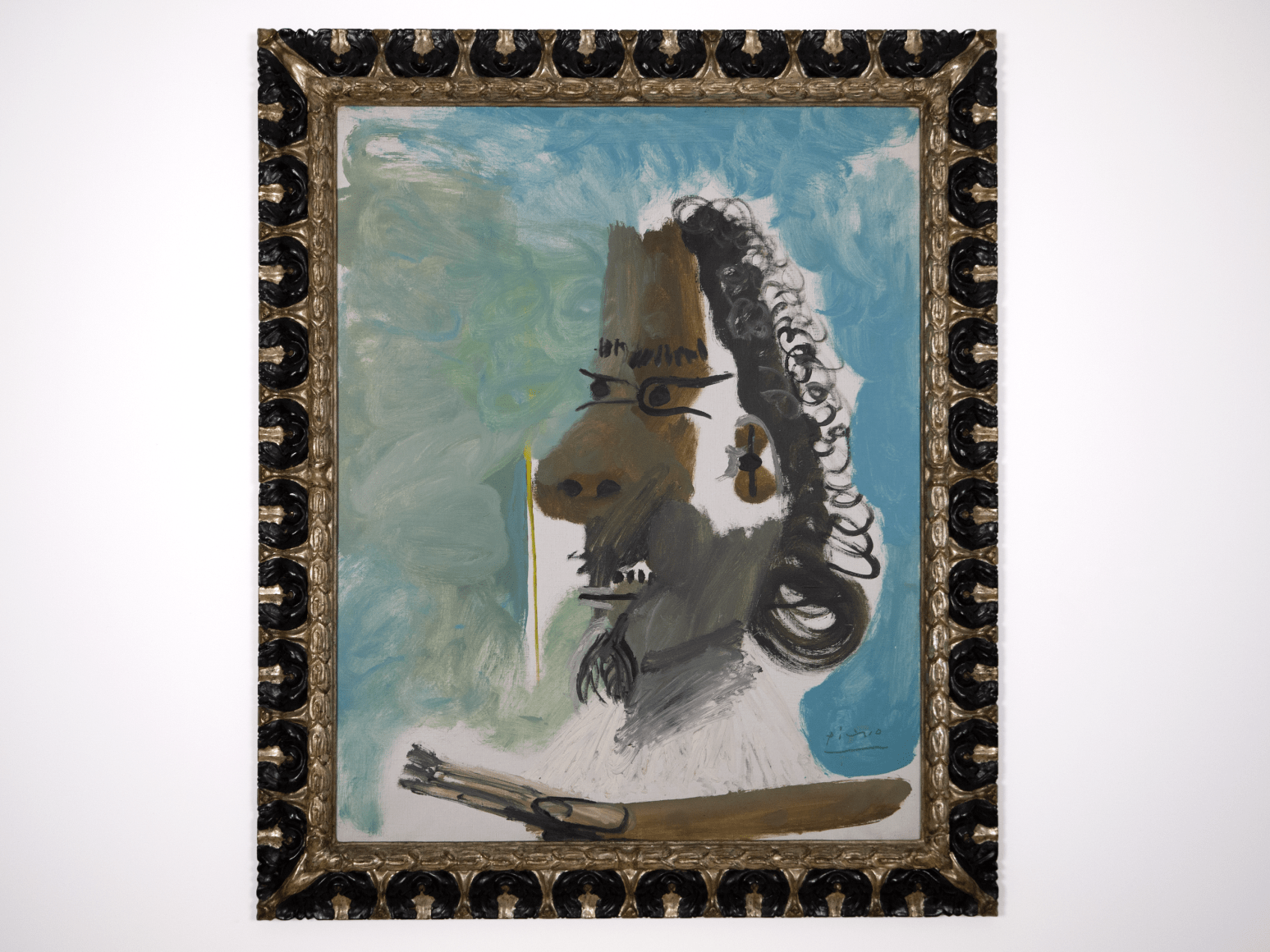 This is a photography of a painting by Picasso in its Spanish frame. The painting produces in 1967 is titled The Painter and represents a Musketeer. Painted two years after Picasso re-reads The Musketeer by Alexandre Dumas.