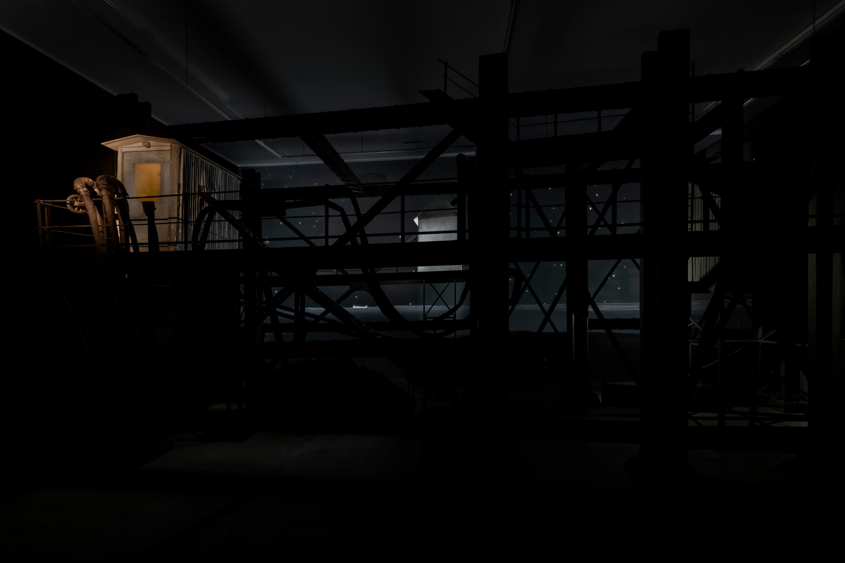 Ship/Dock/Three Houses and the Night Sky, 2023, Wood, plastic, glass, acrylic paint, electrical fixtures, metal, video projections, sound, darkness, 12’ x 29’9” x 14’9”