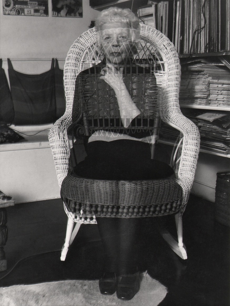 02. David Attie, Lisette Model, ​1972. Portrait of a woman seated on a wicker chair. Double-exposure affect makes the woman appear semi-transparent.