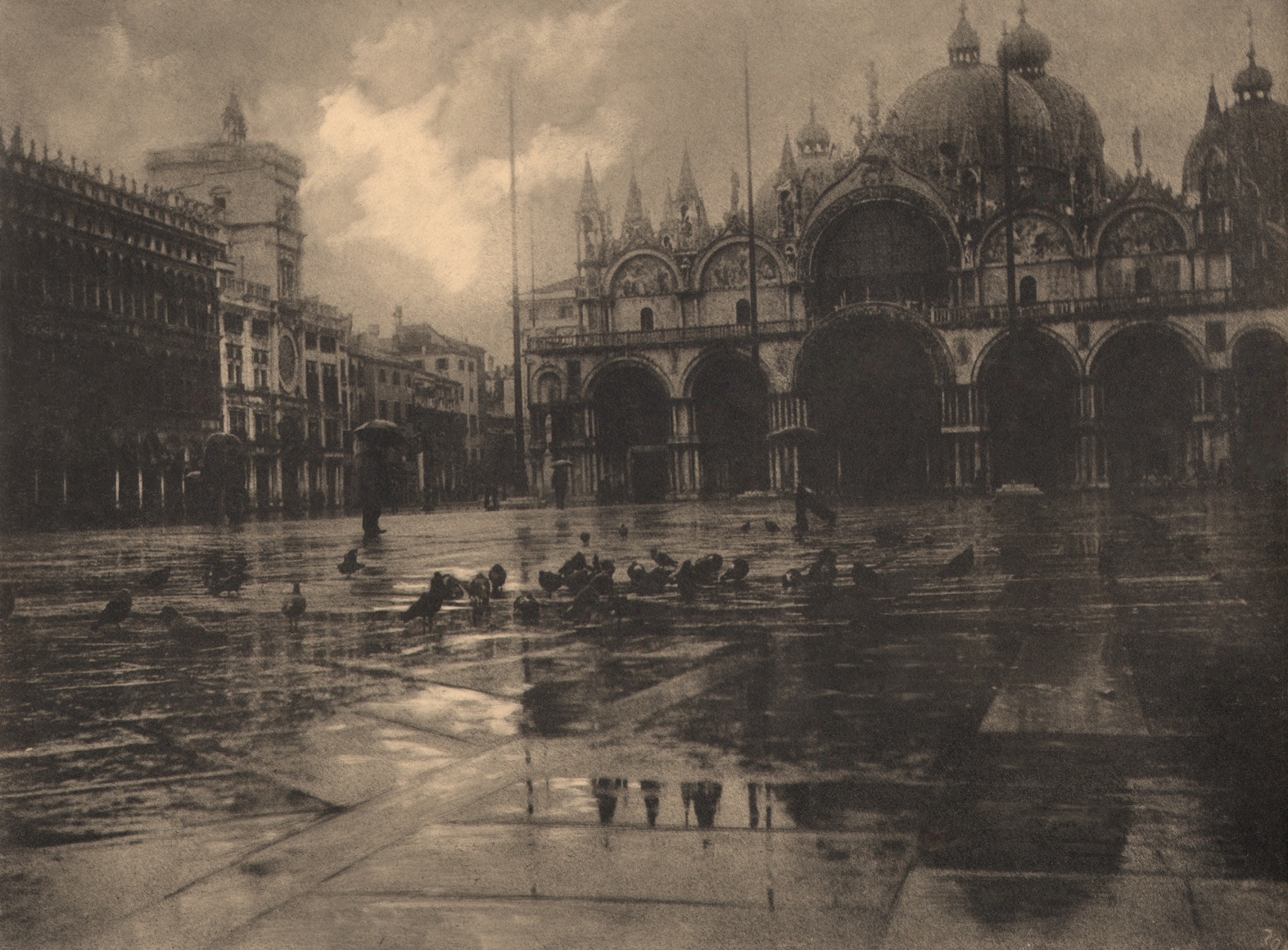32. L&eacute;onard Misonne, Pluie Venise, 1936. Italian square with wet pavement and pigeons, ornate buildings in the background. Sepia-toned print.