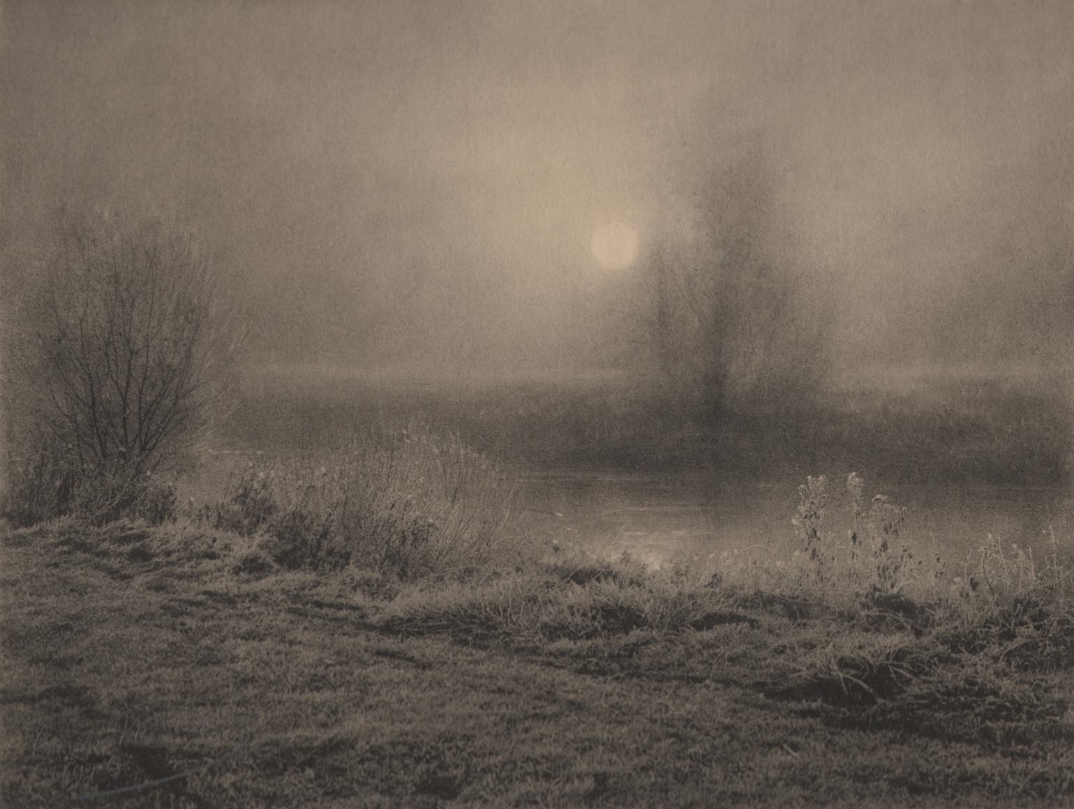14. L&eacute;onard Misonne, Aurora a'hiver, 1926. Frosted brush and trees alongside a river in hazy sunlight. Sepia-toned print.