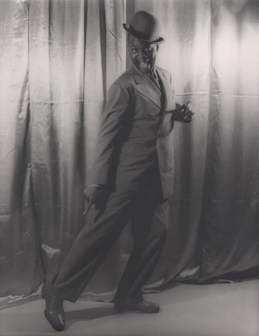 32. Carl Van Vechten, Bill &quot;Bojangles&quot; Robinson, 1941. Full-body portrait with subject pointing to his outstretched right leg with toe touching the floor.