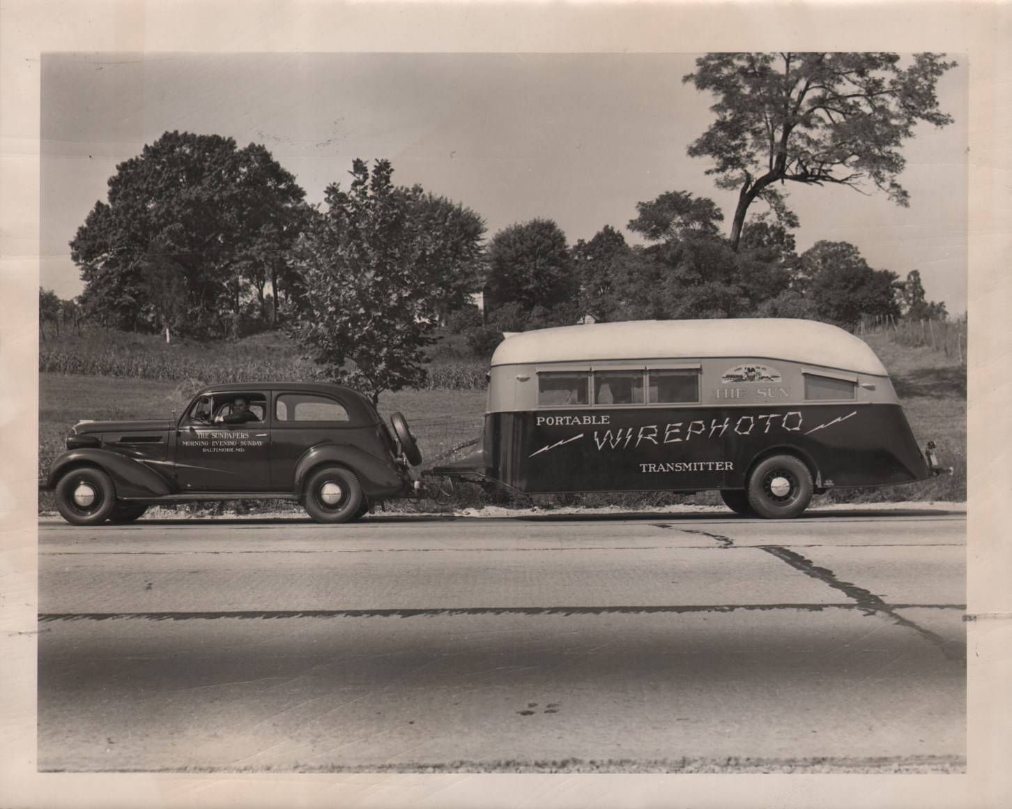 45. Sun Wire Photo, Sun Wire Photo Trailer, ​October 7, 1937. A car tows a trailer marked &quot;Portable wire photo transmitter&quot;