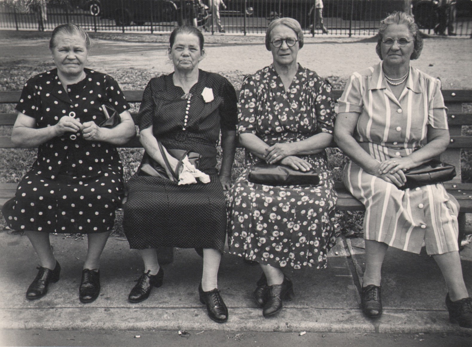 26. Jeanne Ebstel, Untitled, c. 1945. Four middle aged women sitting on a park bench, looking to the camera.