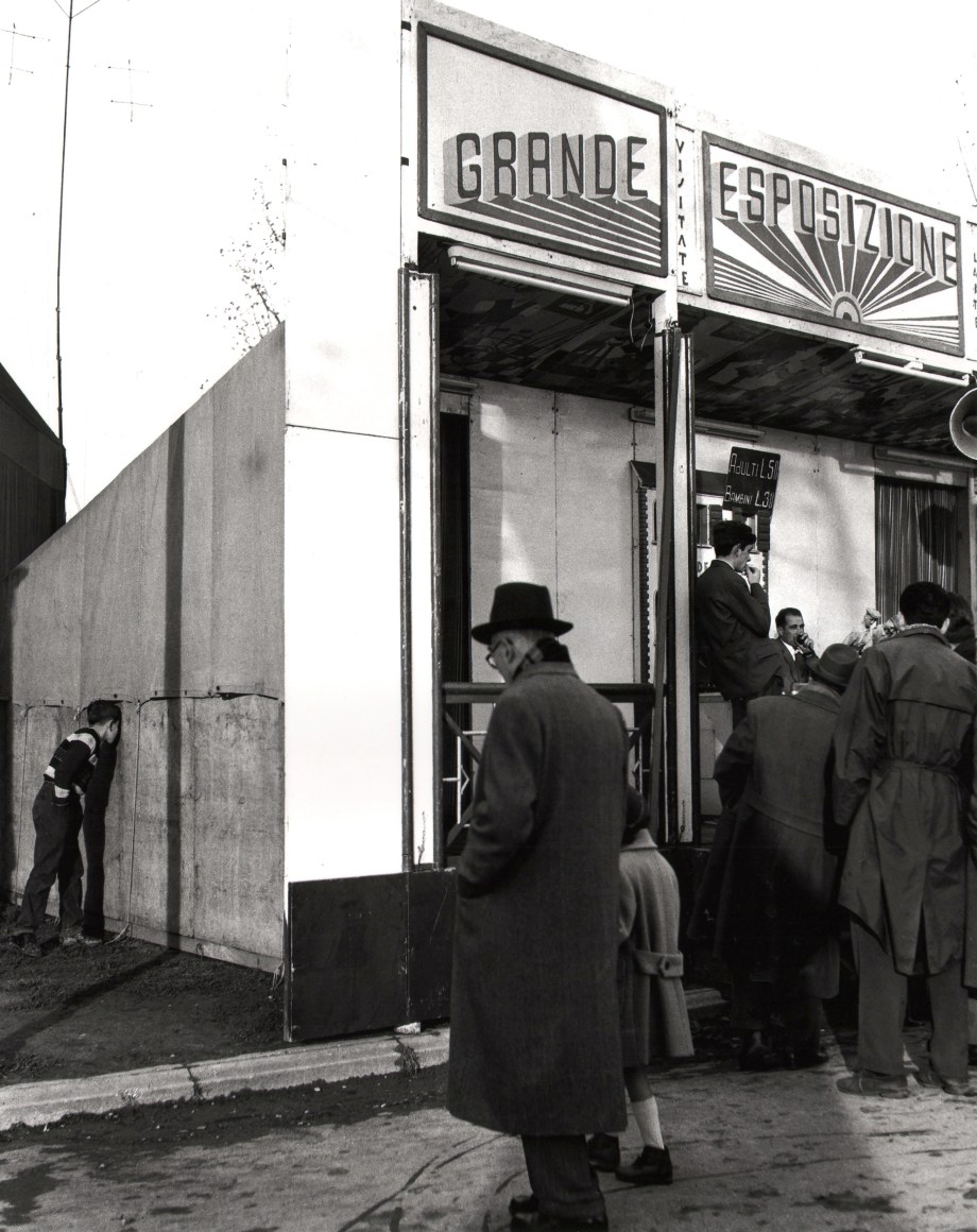 Nino Migliori, People of Emilia, 1950. Patrons gathered outside a building marked &quot;Grande Esposizione&quot;