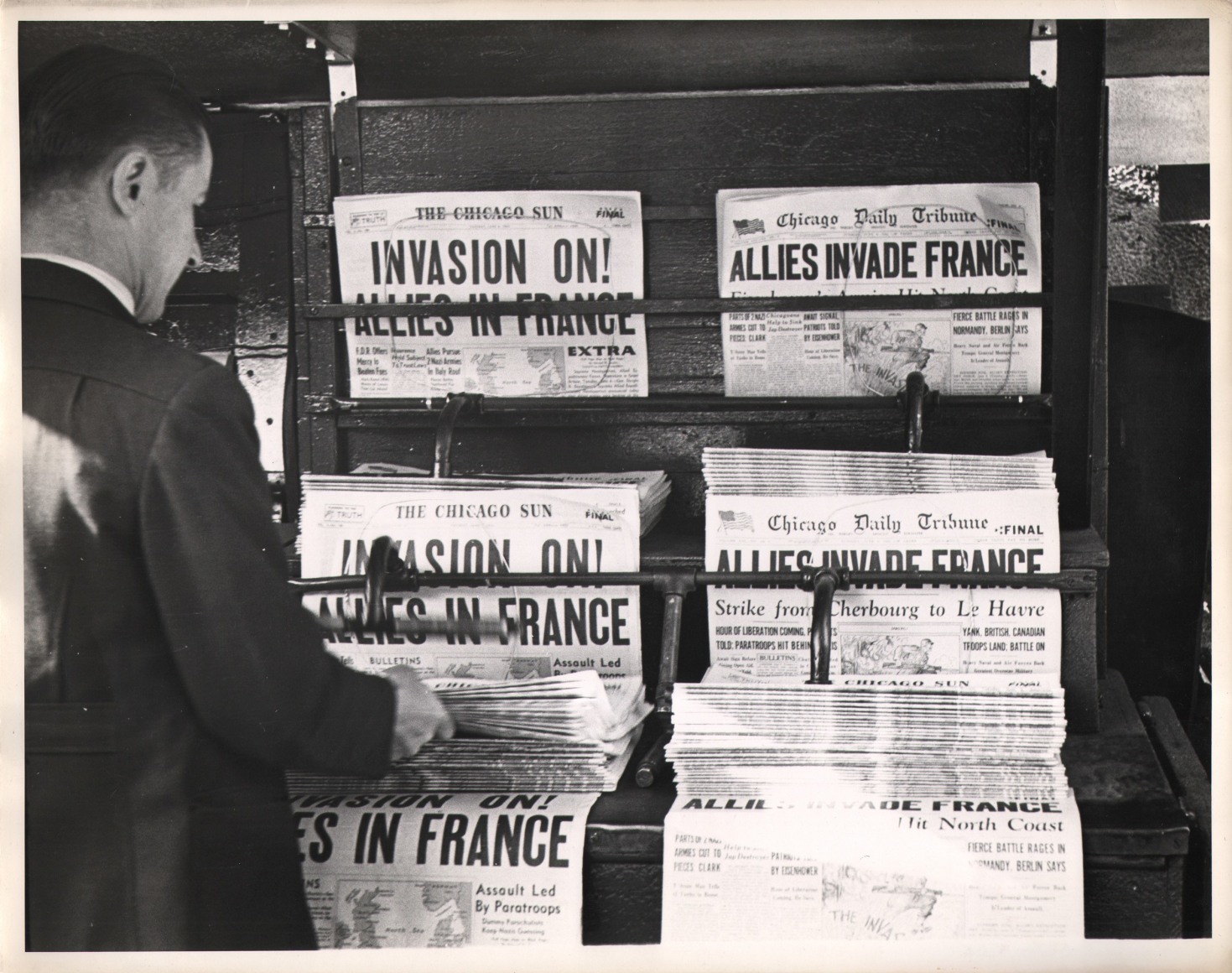 20. Gordon Coster, Untitled, ​1944. Newspaper display with headlines such as &quot;Allies Invade France&quot; and &quot;Invasion On! Allies in France&quot;