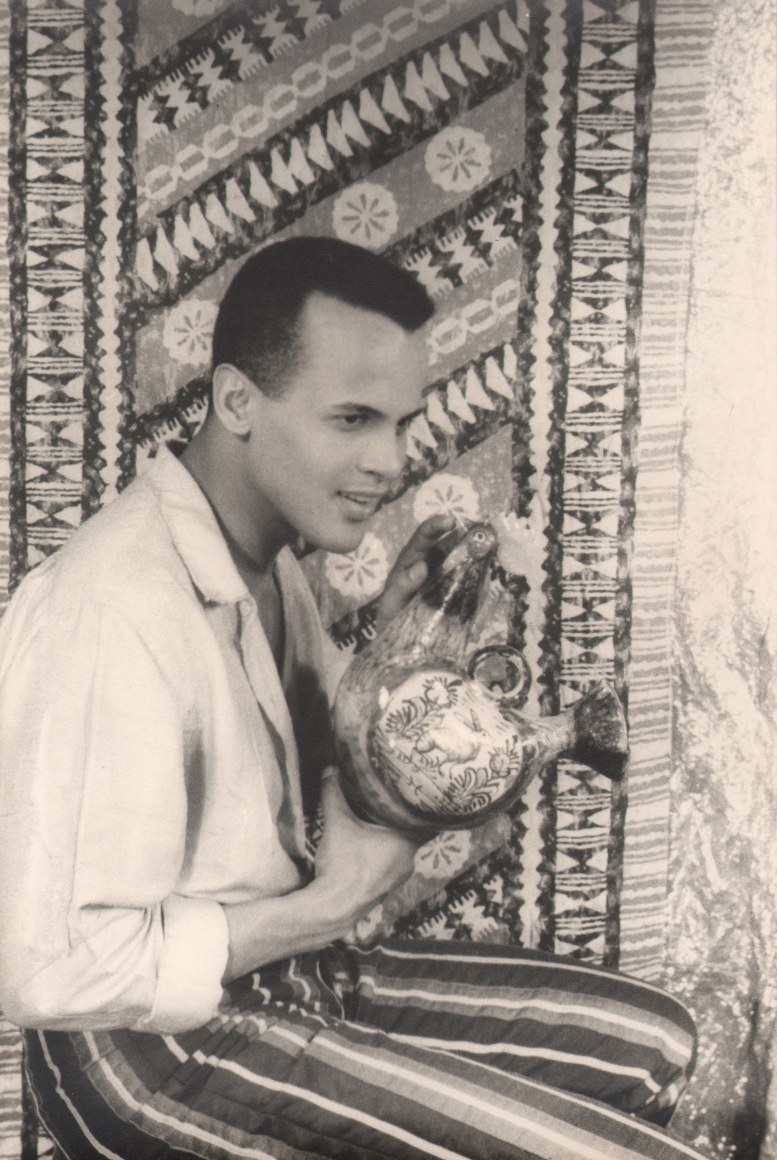 33. Carl Van Vechten, Harry Belafonte in Almanac, 1954. Seated portrait with subject facing the right holding a ceramic chicken.