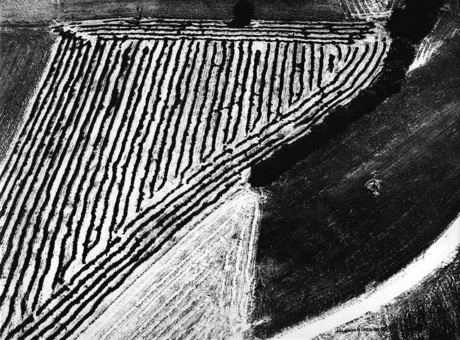Mario Giacomelli, Presa di conscienza sulla natura, 1976/1990. Abstract landscape divided into three sections: a striped triangle in the upper left, a white triangle in the lower left, and a black square section in the lower right.