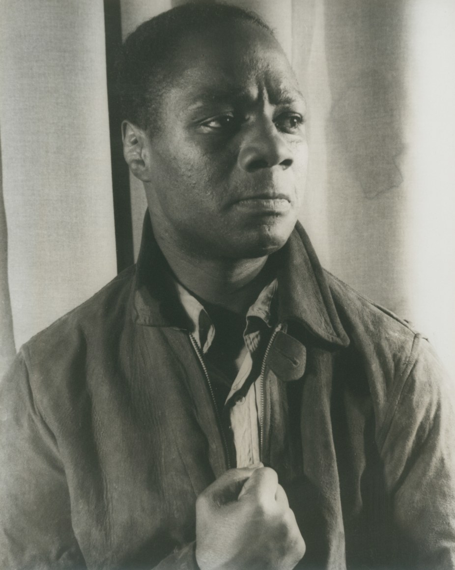 19. Carl Van Vechten, Canada Lee as Bigger Thomas, 1941. Bust-length portrait with subject looking to the right of the frame with brows furrowed, one fist at his chest.