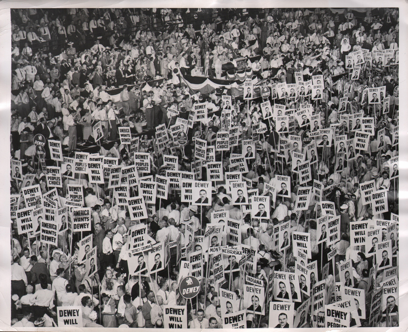 39. United Press, Every Fourth Year..., ​May 30, 1952. Large crowd photographed from above holding signs reading &quot;Dewey,&quot; &quot;Dewey will win,&quot; and &quot;Dewey the people's choice&quot;
