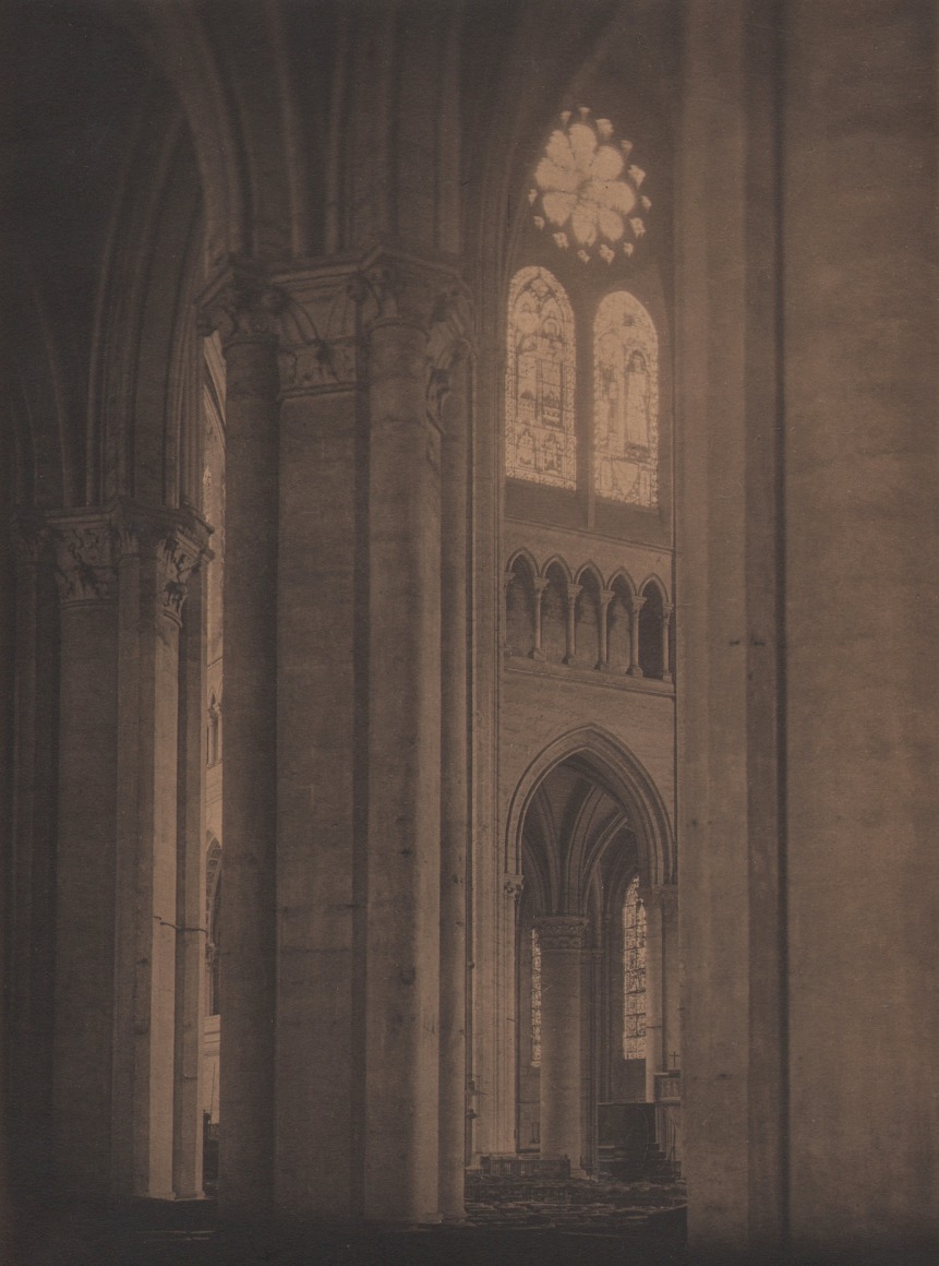 14. Antoinette B. Hervey, Our Lady of Chartr&eacute;s, France, c. 1932. Interior view of a cathedral with columns, archways, and stained glass windows.