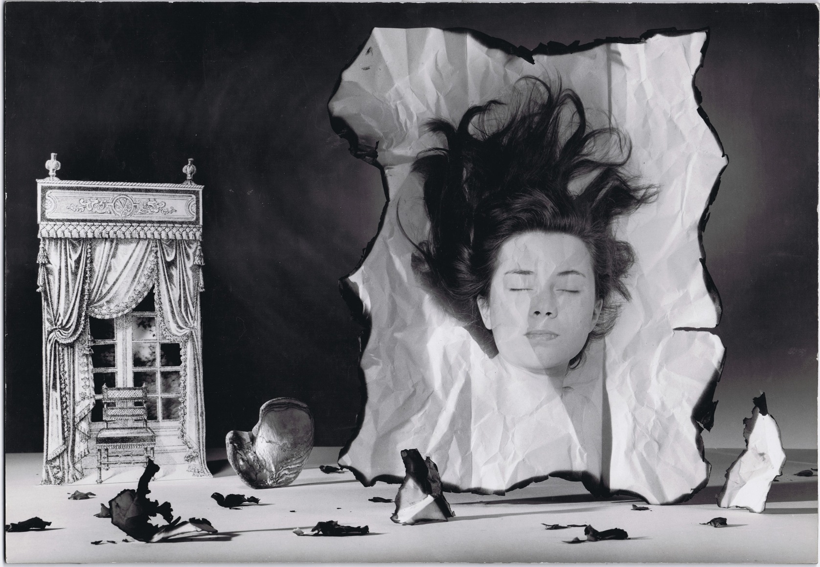 Rolf Tietgens, Patricia Highsmith, ​1942. Image of a woman with closed eyes and hair spread as if laying down, superimposed on a still life with burned paper and a small window and chair tableau.