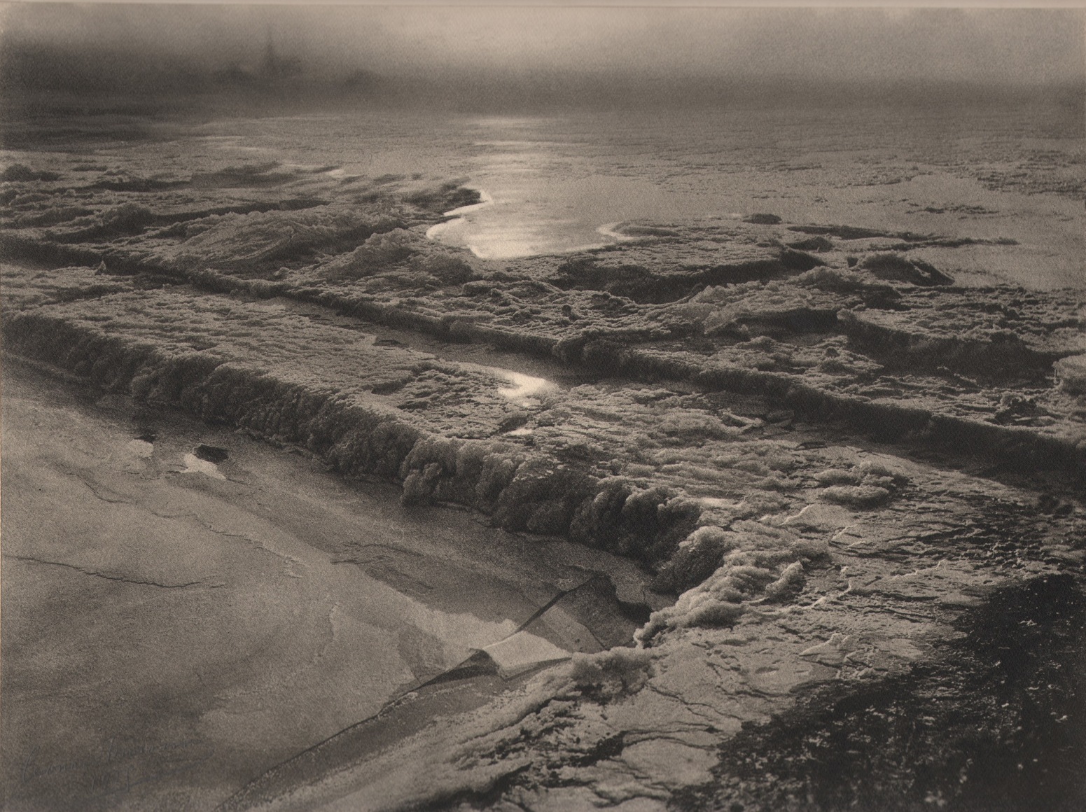11. L&eacute;onard Misonne, Le barrage gel&egrave;, c. 1935. Frozen body of water in early morning, hazy light. Sepia-toned print.