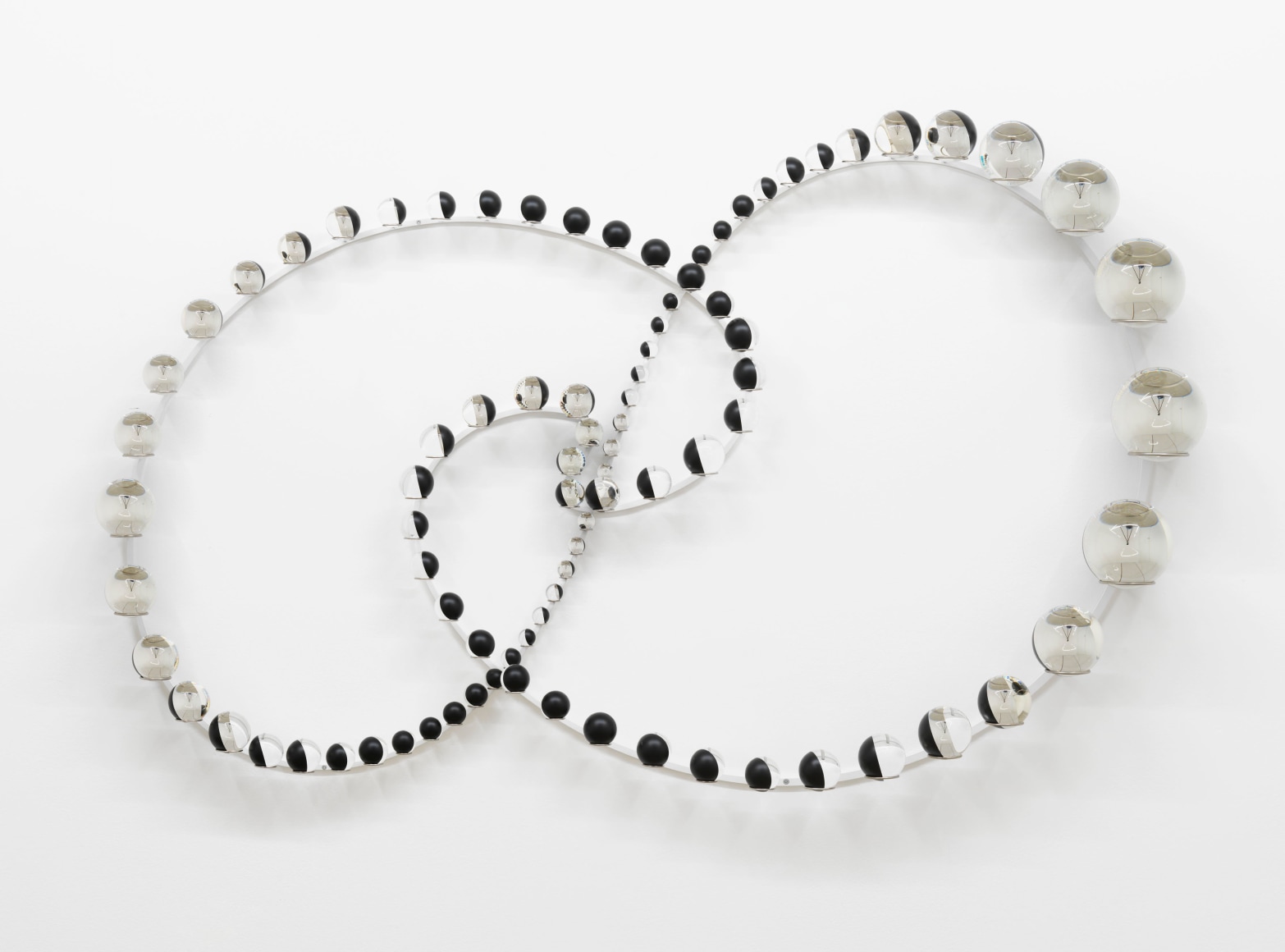 Olafur Eliasson, Orbital centrifugal presence, 2022. Partially silvered glass spheres, stainless steel, paint (black, white),, 113 x 174 x 20 cm. Courtesy of the artist & PKM Gallery. Photo: Jens Ziehe