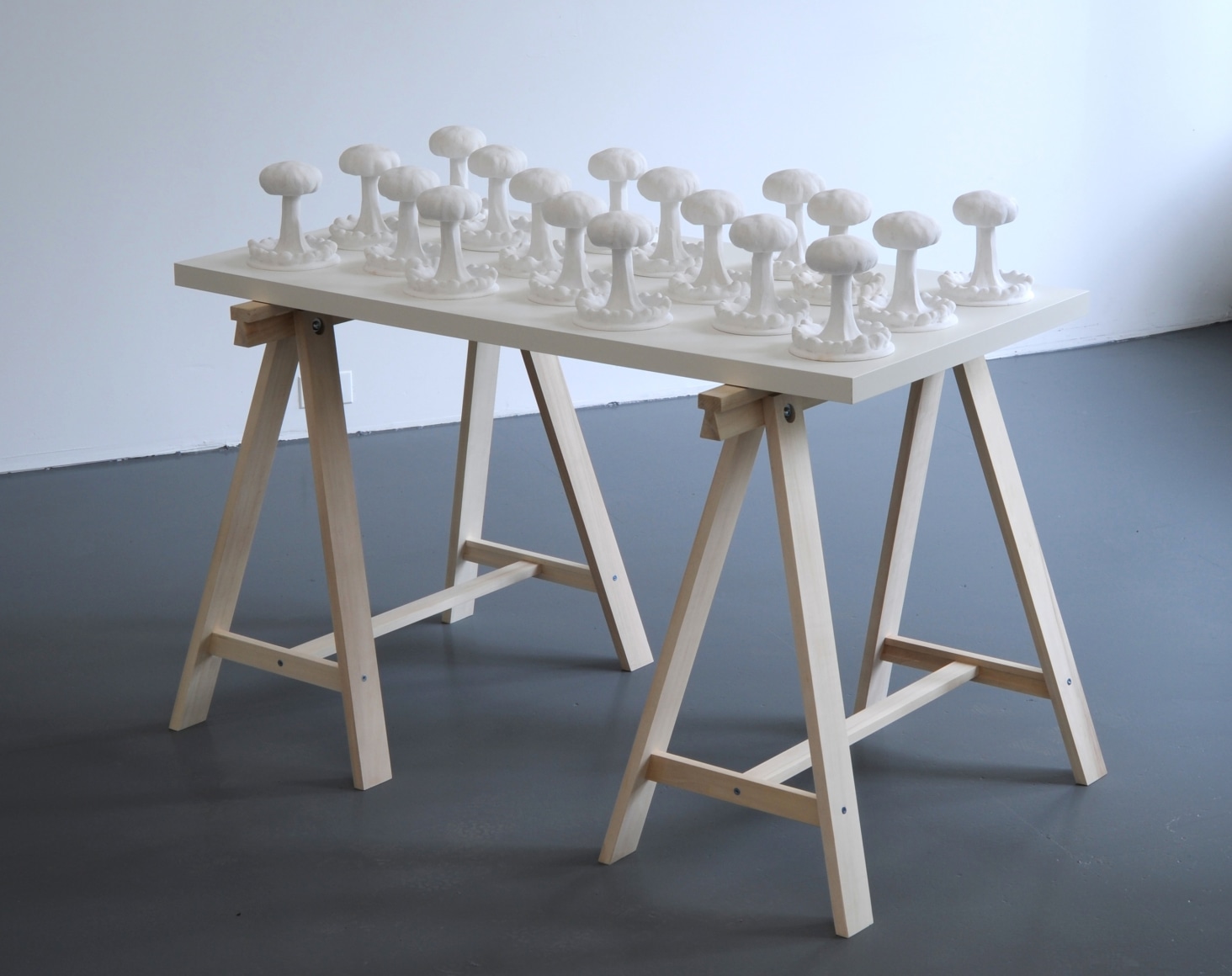 KENNY HUNTER Atomic Field 2009, plaster, wood, trestles, 3.94 x 59.06 x 23.62 inches.