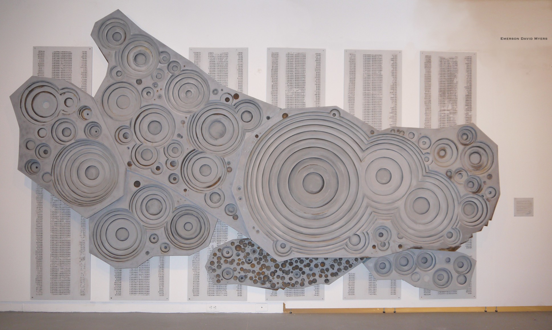 EMERSON MYERS #Inches(100 Kilotons)(#Layers)=YIELD 2014, polished and rusted iron, paint, ash, and charcoal on wood, 174 x 108 inches.