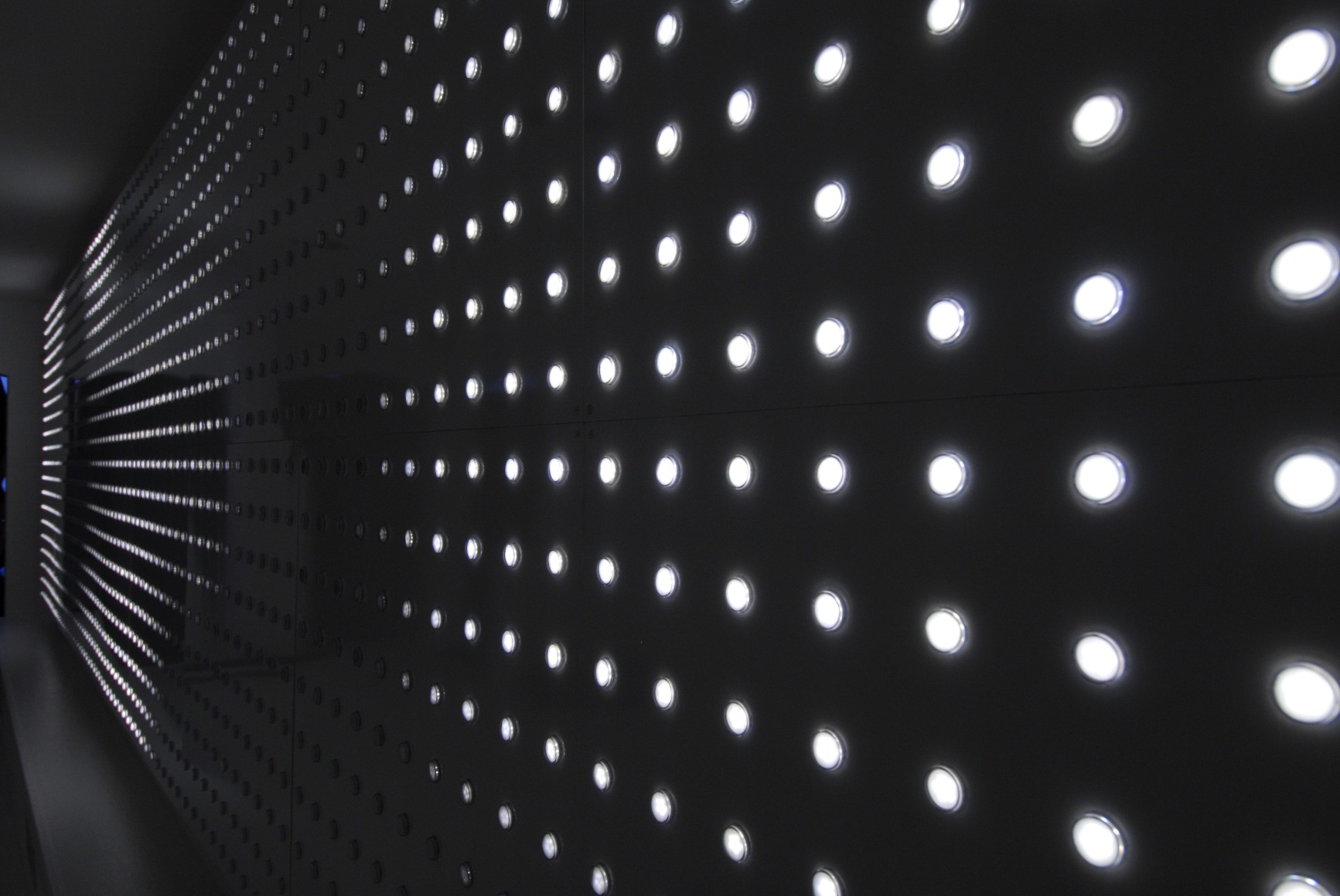 LEO VILLAREAL  Origin  2006, LEDs, circuitry, microcontrollers, aluminum and wood, 80 x 320 x 3 inches inches. Installation View: CONNERSMITH.
