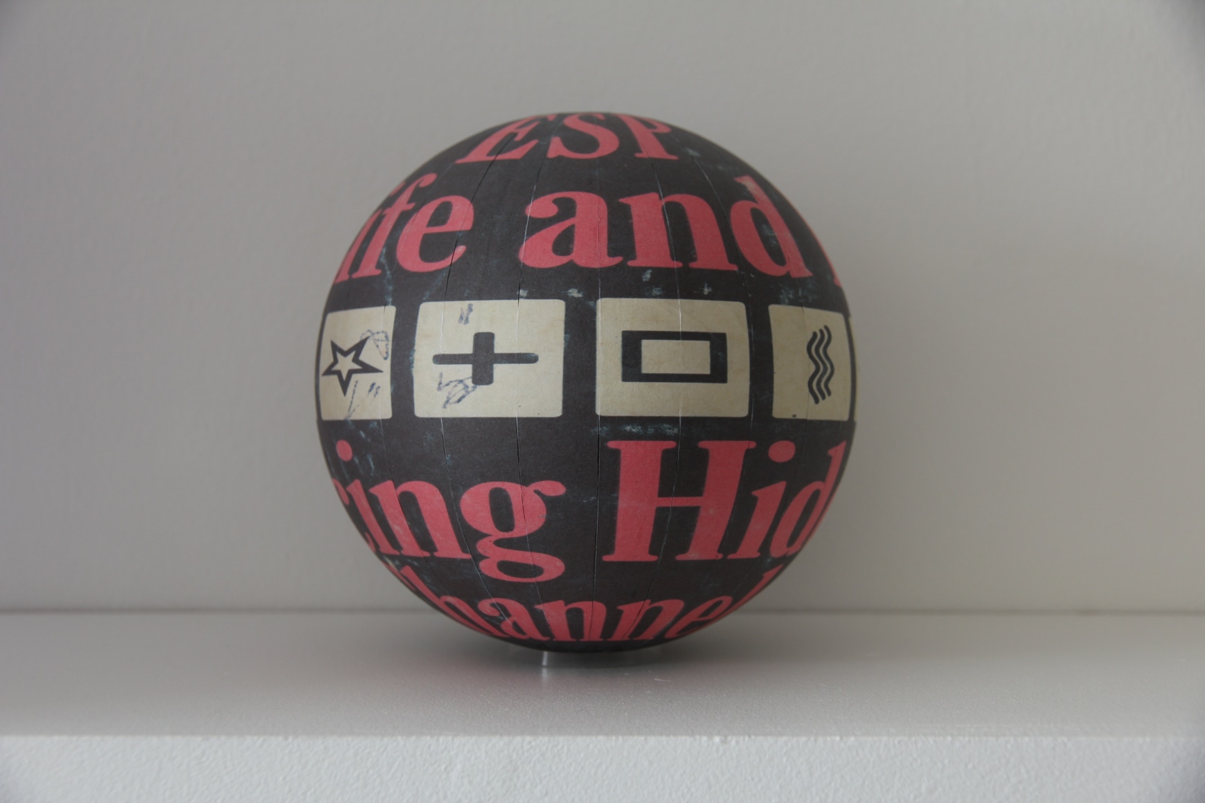 Susan MacWilliam  ESP In Life And Lab  2013-14, inkjet paper, plastic sphere, 6 x 6 x 6 inches, unique.