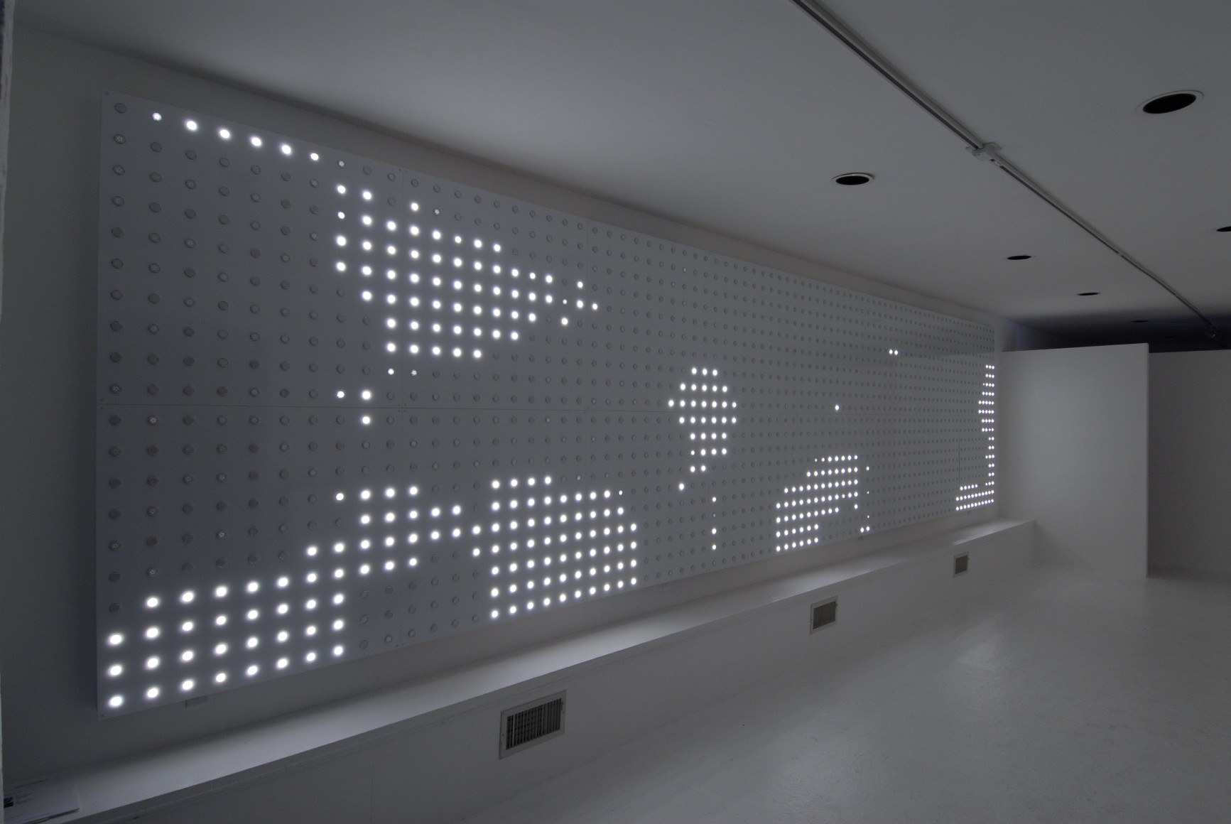LEO VILLAREAL  Origin  2006, LEDs, circuitry, microcontrollers, aluminum and wood, 80 x 320 x 3 inches inches. Installation View: CONNERSMITH.