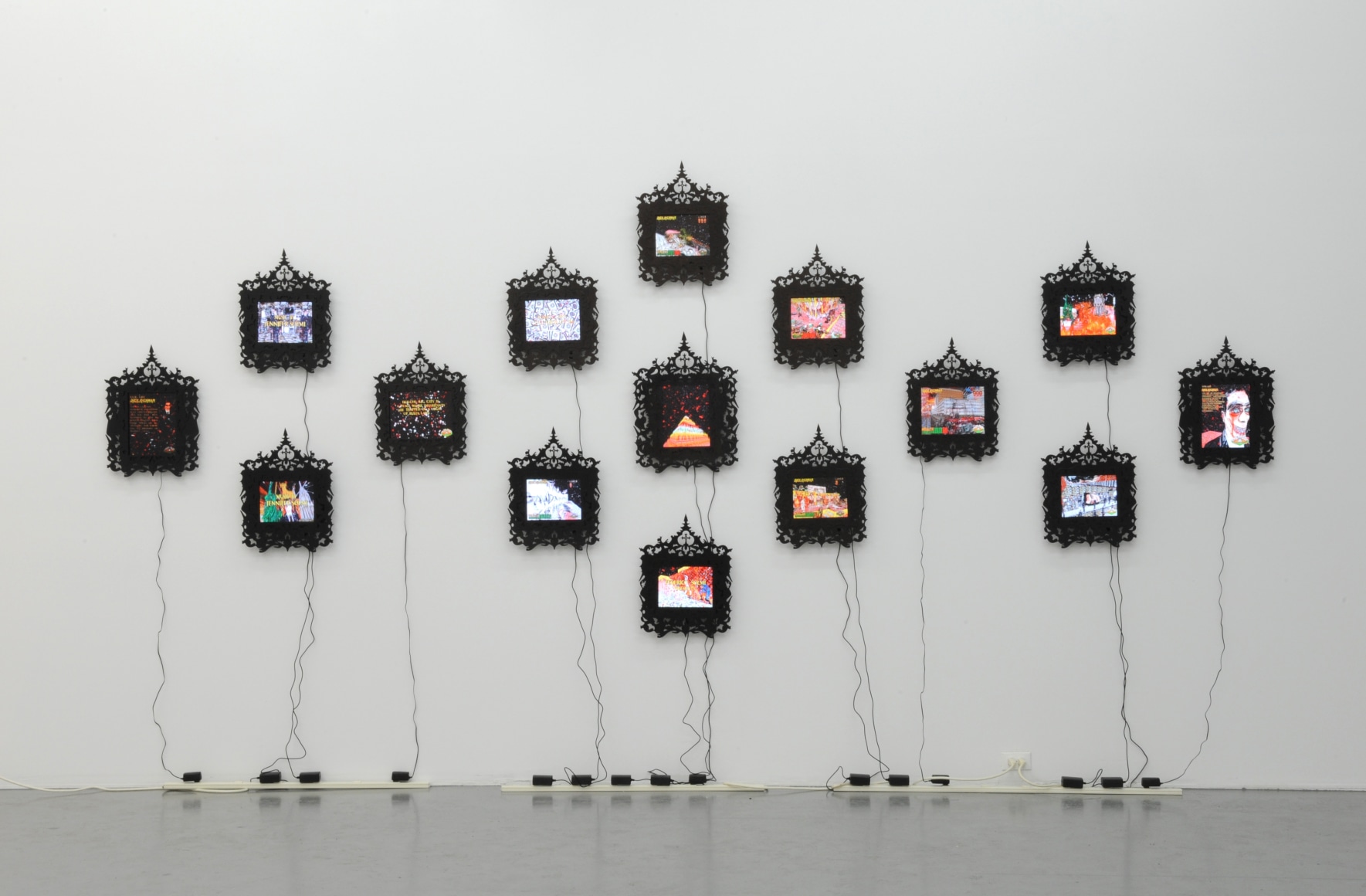 FEDERICO SOLMI Douche Bag City 2010, 15 framed LCD panels with video animation, dimensions variable, ed: 5. Installation view: Conner Contemporary Art.