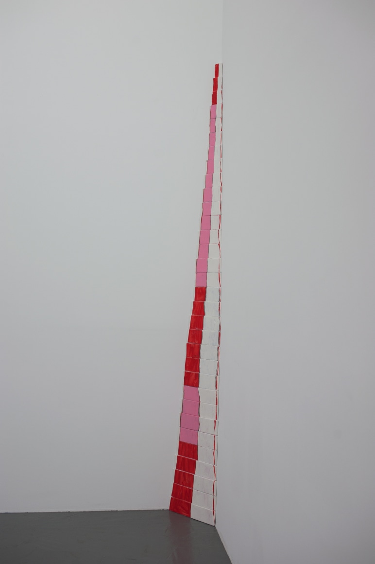 CORDY RYMAN Red Fade Corner 2010, acrylic and shellac on wood, 32 pieces, 108 x 9 x 7 inches