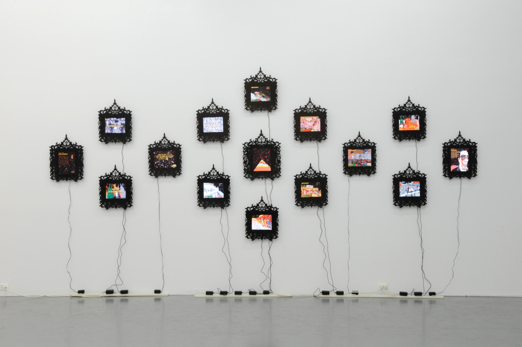 FEDERICO SOLMI Douche Bag City 2009-10, 15 framed LCD panels with artist designed frame, ed: 5. Installation view: Conner Contemporary Art.