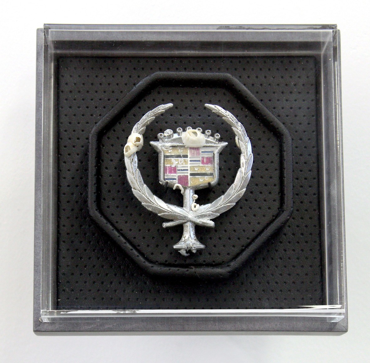Benjamin Kelley  Untitled 07  2019, Vinyl, acrylic, valcromat, barnacle encrusted Cadillac emblem, 6.25 x 6.25 x 6 inches.