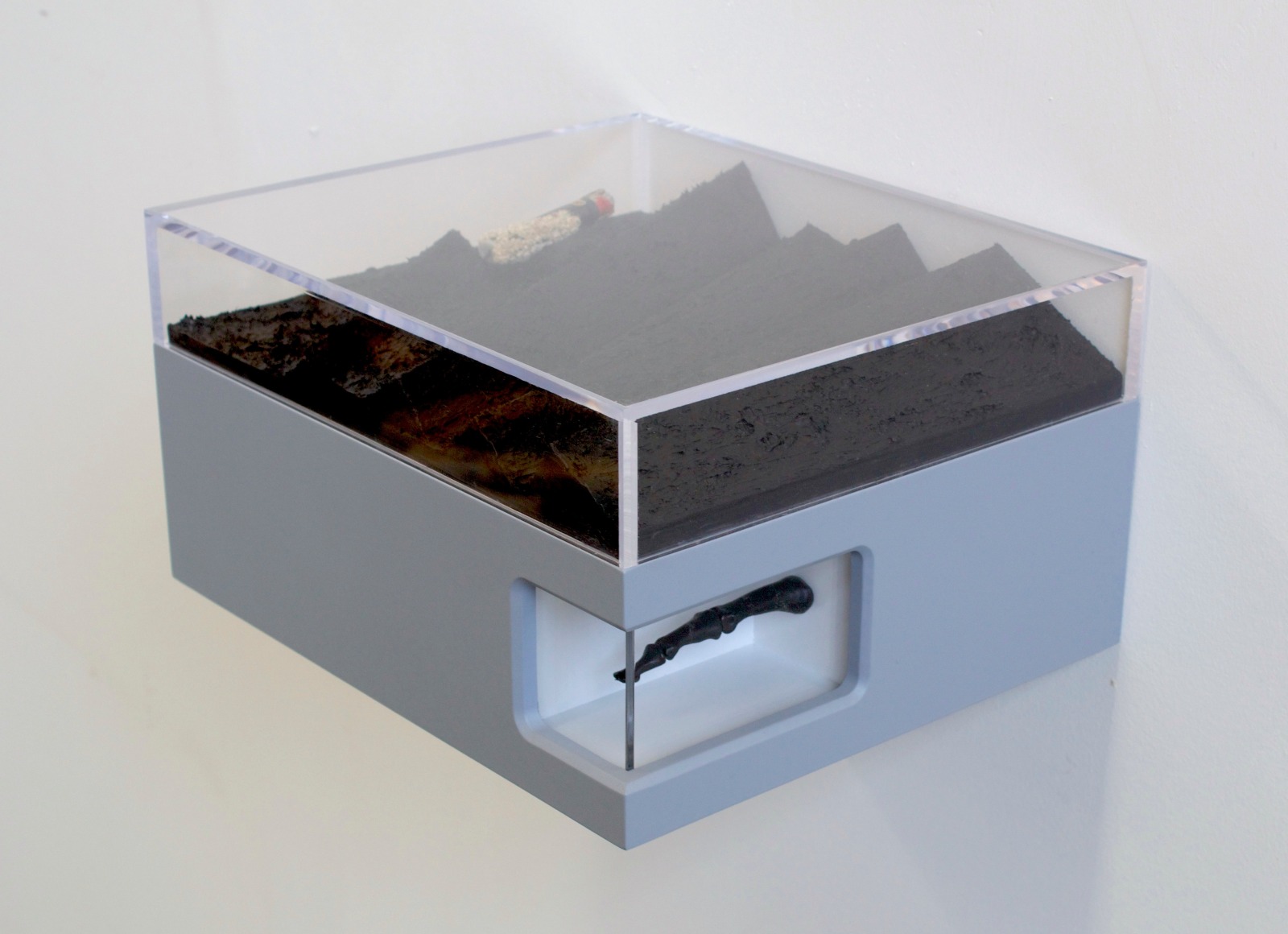 Benjamin Kelley  Untitled 02  2019, Painted wood, acrylic, silicone, barnacle encrusted lighter, ancient bog oak carved (human finger bones articulated).