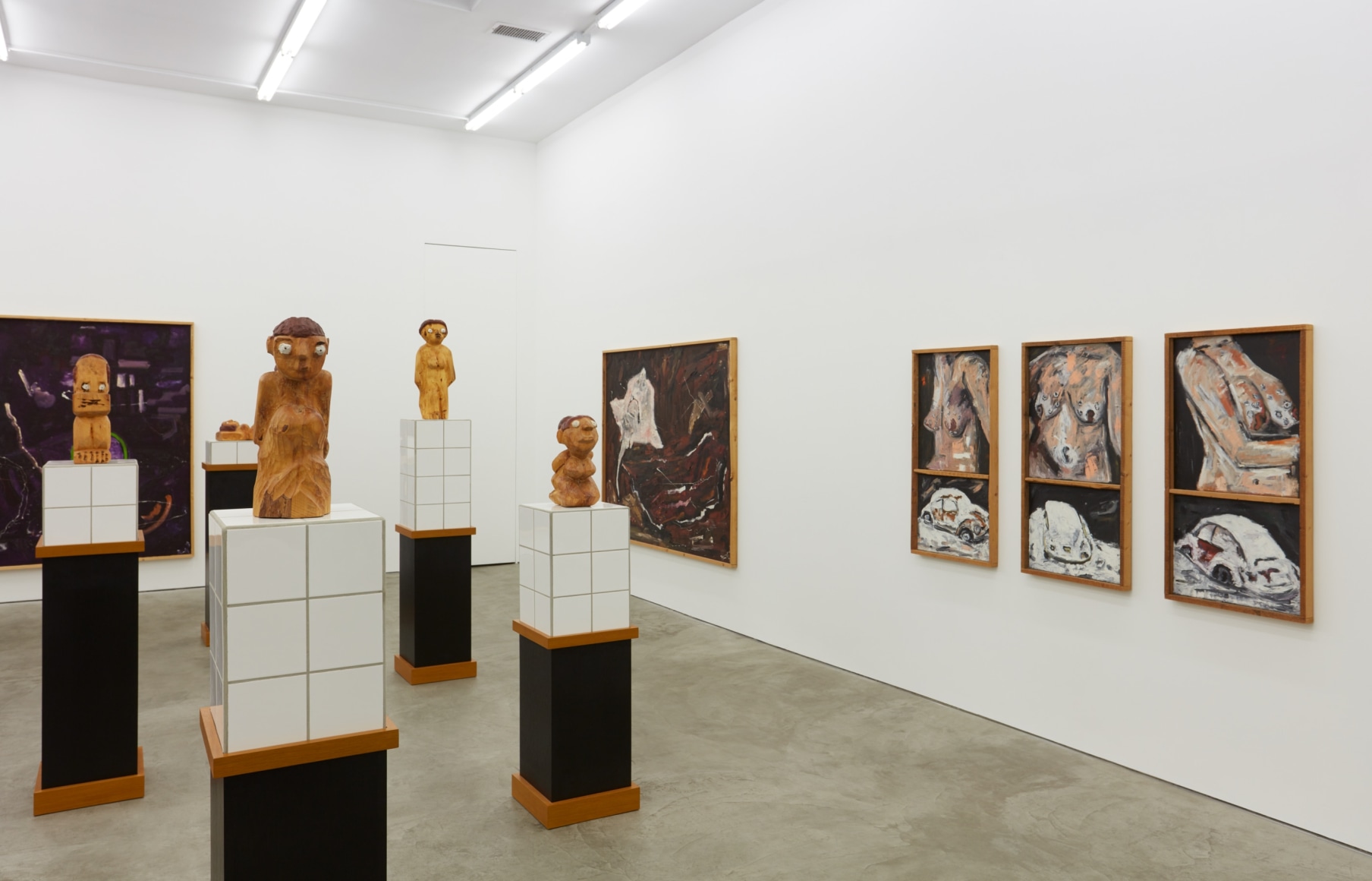 Installation View of "Werner Büttner Works from the Eighties" (2019), specifically highlighting "So ist es aber: Kleiner Hängebusen voller Fingerabdrücke und verschneiter VW"