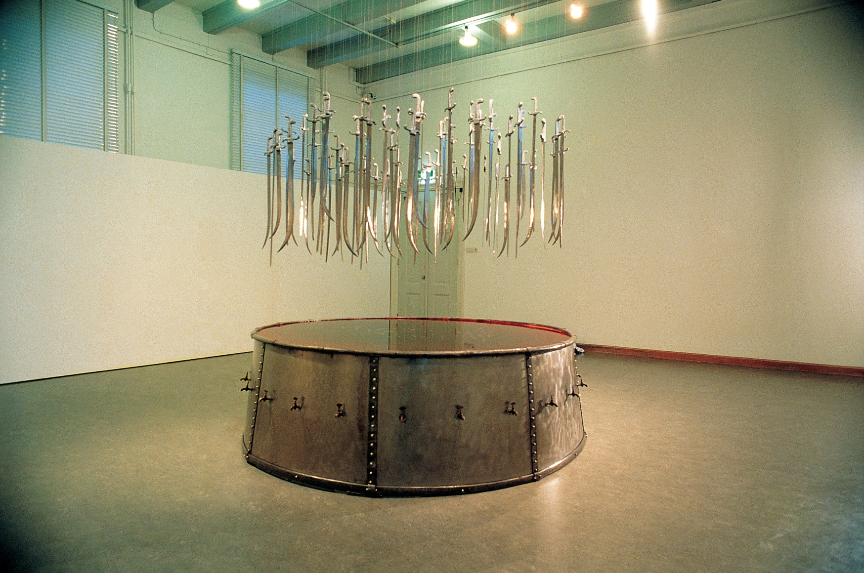 Hale Tenger, The School of Sikimden Assa Kasimpasa, 1990, Galvanized sheet iron, lead, sword, tap, water, dye, diam, Dimensions variable