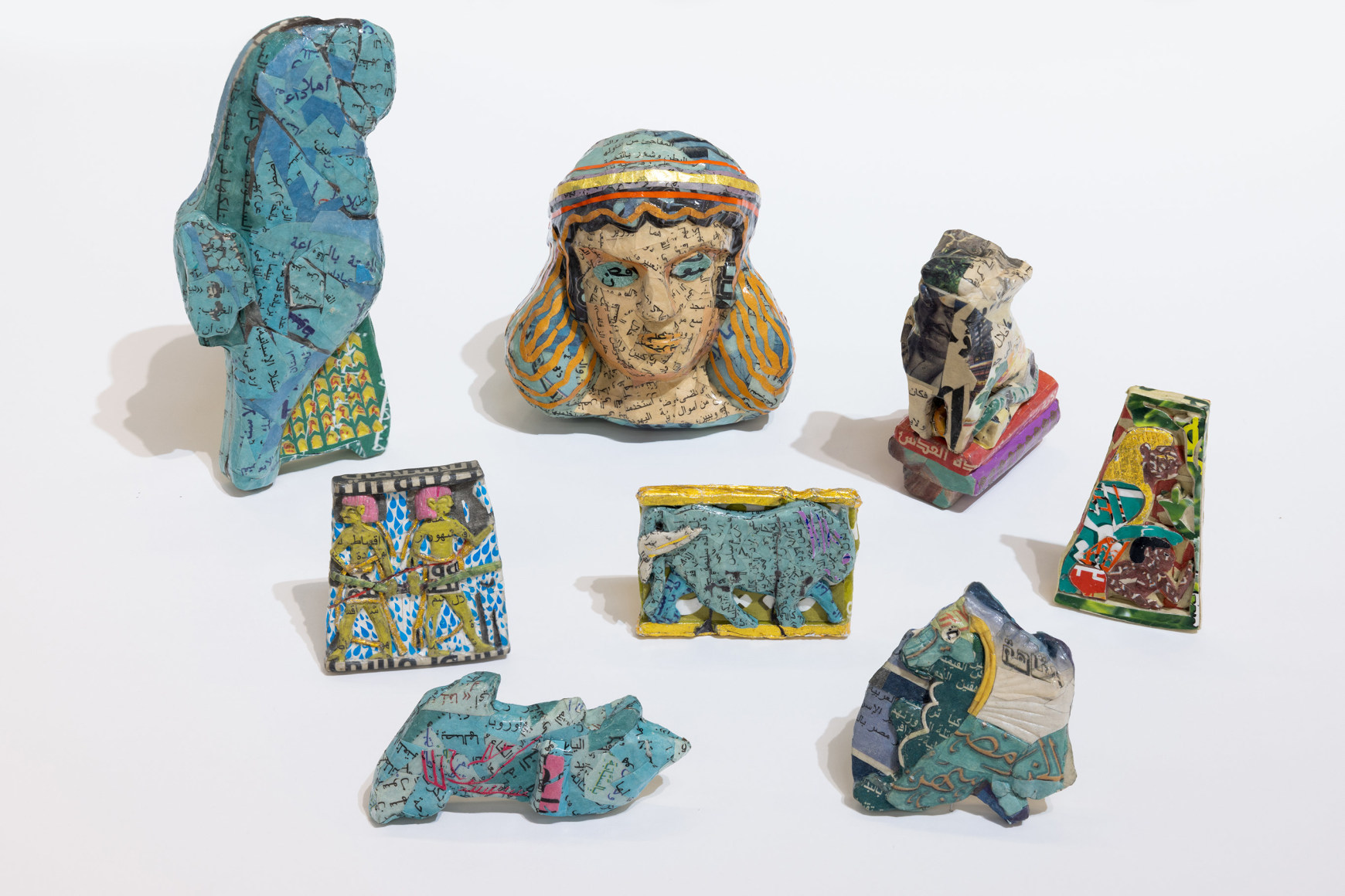 Michael Rakowitz, The invisible enemy should not exist, 2022, Arabic newspaper and food packaging cardboard sculptures, museum labels