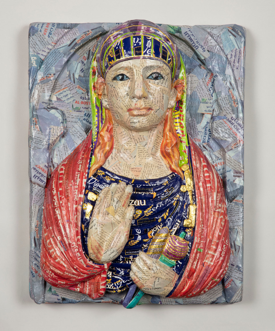 Michael Rakowitz, May The Obdurate Foe Not Be In Good Health (Limestone Funerary Bust), 2020, Middle Eastern food packaging and newspaper, with glue on panel, 56 x 43 x 16 cm