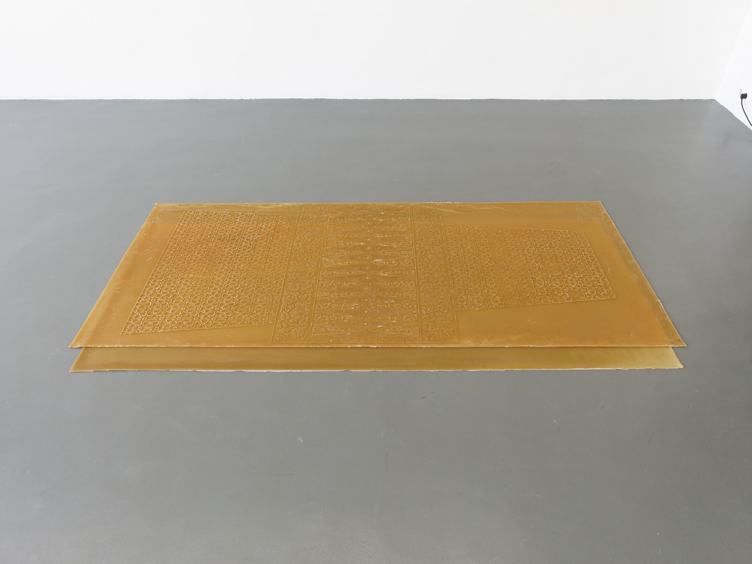 Rossella Biscotti,&nbsp;Surati, 2019, Installation of two natural rubber sheets, 240 x 105 and 210 x 100 cm