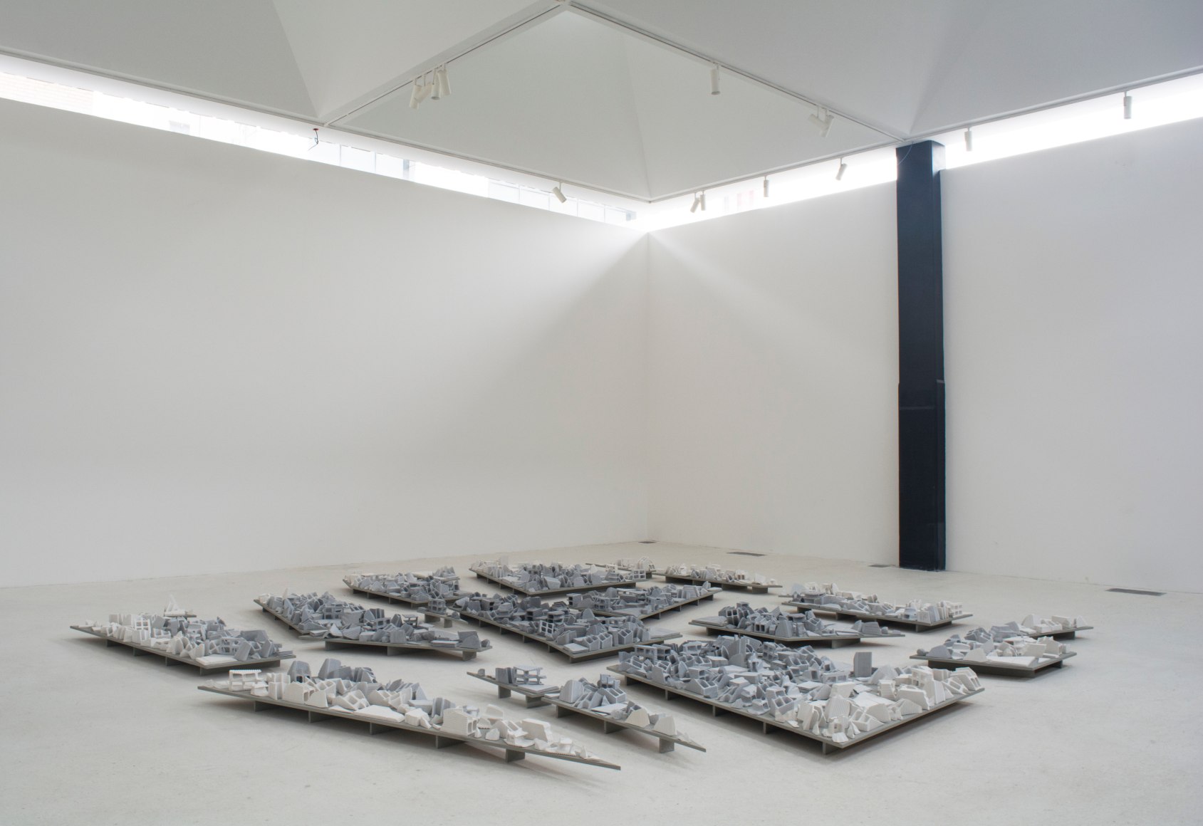 Nazgol Ansarinia, The Mechanism&nbsp;of Growth, demolishing buildings, buying waste, 2017, Plaster, pigment and glue, Dimensions variable