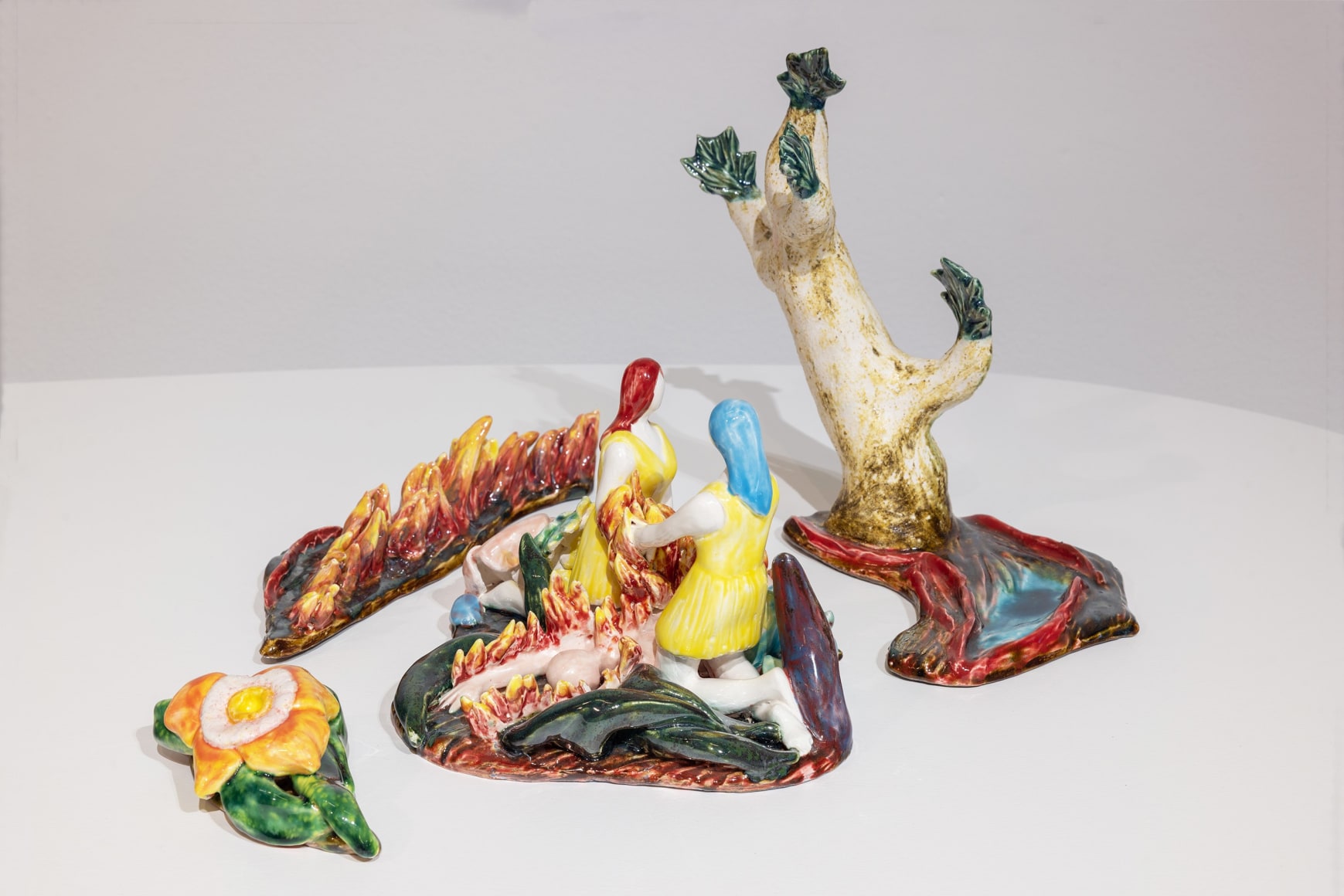 Dorsa Asadi, Bending Sinnerman offering his burning flesh to Elle and Belle, 2022, Ceramics, Composed of 4 pieces